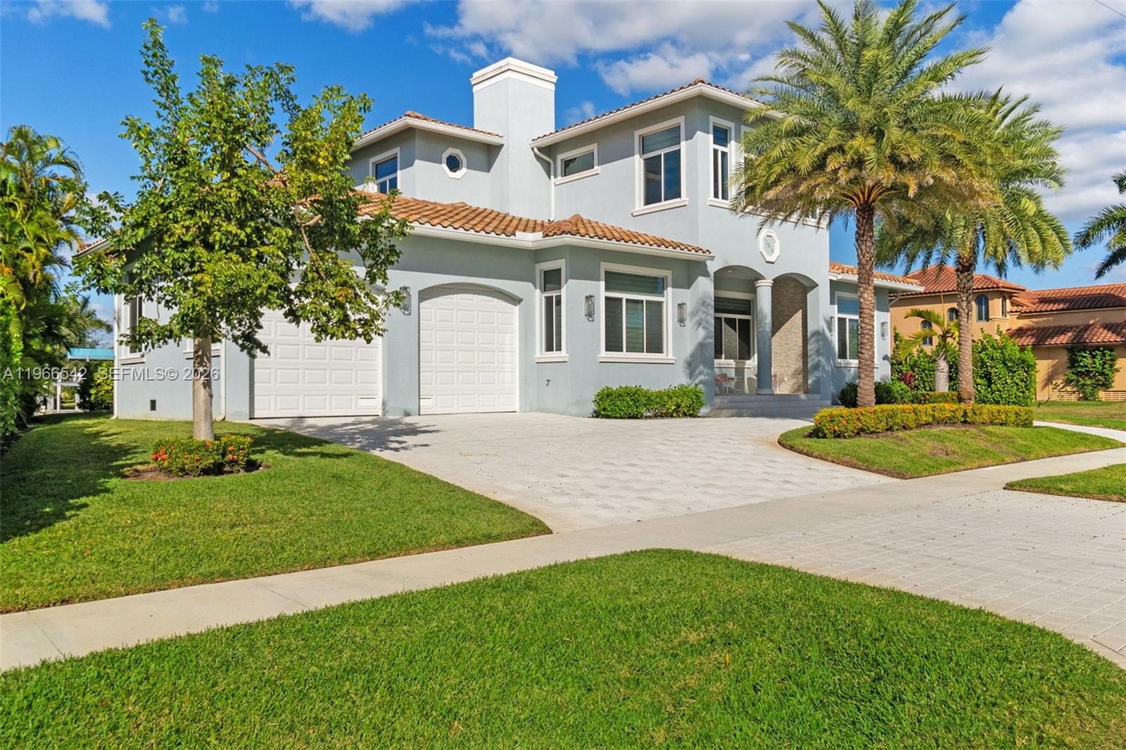 Luxurious fully furnished Marco Island waterfront residence, professionally decorated and move-in ready. This 4-bedroom, 4-bath home blends refined design with effortless coastal living, showcasing tranquil channel views and water access with potential for dock addition.

Soaring 24-foot ceilings, porcelain flooring throughout the home and balconies, wood crown moldings, and custom coffered ceilings create a grand yet inviting interior. The open-concept living and dining areas are filled with natural light and designed for entertaining. The chef’s kitchen features KitchenAid Architect Series appliances and Taj Mahal Brazilian stone countertops, while all bathrooms and the laundry room are finished in white quartz. Custom built-in closets, impact windows and doors, barrel tile roof, exterior camera system, elevator, and dual AC units add comfort and peace of mind.

The entire second floor is dedicated to the private primary suite with sitting area, spa-style bath, and oversized closet, while a first-floor junior ensuite is ideal for guests or multigenerational living.

Outdoors, enjoy a resort-style setting with a heated Pentair pool and spa on an expansive deck overlooking the water, plus convenient pool bath access. A paver driveway and two-car garage complete the property.

Experience the Marco Island lifestyle with boating, sunsets, and year-round entertaining in a home designed for luxury and relaxation.