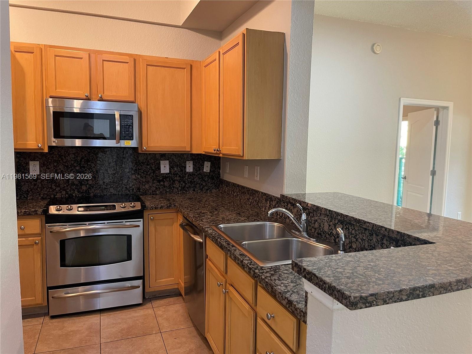 Beautifully remodeled 1010 Sq Ft first-floor 2-bedroom, 2-bath condo in a prime South Miami location. Featuring durable tile flooring throughout and a highly desirable split floor plan, each bedroom functions as a private suite with a walk-in closet and ensuite bathroom with tub/shower combination—ideal for roommates, guests, or flexible living arrangements.

This highly desirable first-floor unit offers a premium pool view and one of the best locations in the community, just steps from the main amenities. The spacious living and dining area opens to a private patio overlooking the pool, creating a relaxing setting for everyday living or entertaining.

The unit includes a full-size washer and dryer and two assigned covered parking spaces, a rare and valuable feature in the area. Strong rental appeal due to its close proximity to the University of Miami, as well as nearby medical centers including Larkin Community Hospital and Baptist Health South Miami Hospital, making it an excellent option for both investors and end users.

Residents enjoy resort-style amenities including a pool, fitness center, clubhouse, billiards room, BBQ area, internet café, and 24-hour security. Conveniently located near shopping, dining, and the Miami-Dade Metrorail for easy commuting.

Perfect opportunity for investors seeking strong rental demand or buyers looking for a well-located home near the University of Miami and Larkin Hospital.
