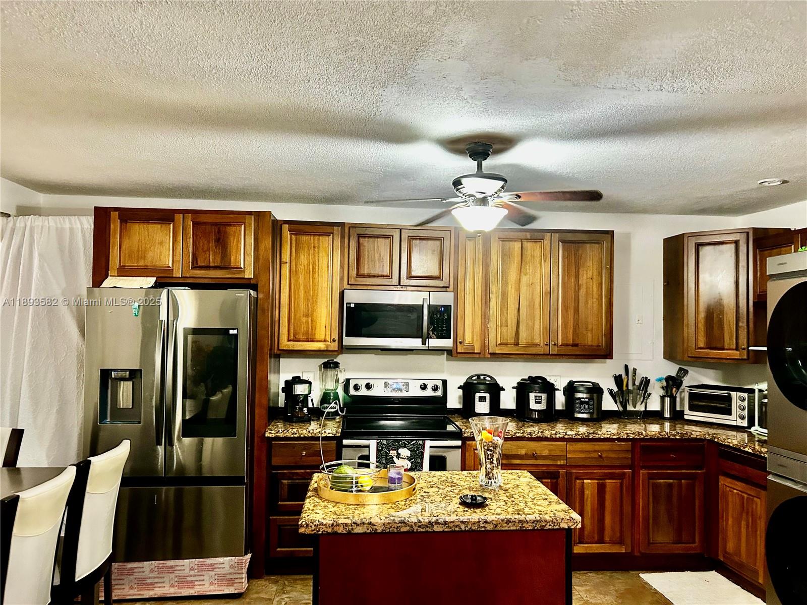 Cozy 2 bedroom 1 bath, with open space kitchen, tile floors, stainless steel appliances! New washer & dryer inside the apartment!!! GREAT OPPORTUNITY FOR INVESTORS-CAN BE RENT IMMEDIATELLY- AND/OR PERMANENT RESIDENCE!! AMAZING LOCATION BETWEEN HOLLYWOOD BLVD AND PEMBROKE RD-CLOSE TO DOWNTOWN HOLLYWOOD, HOLLYWOOD BEACH, SHOPPING, RESTAURANTS AND MAJOR ROADS. LIVE IN ONE OF THE MOST CONVENIENT AND CHARMING AREAS OF  HOLLYWOOD!!  PET FRIENDLY COMMUNITY. ONE ASSIGNED PARKING SPACE PLUS GUEST PARKING. RENT INCLUDES WATER. NICE POOL WITH BARBECUE AREA & LARGE BACKYARD. LAUNDRY FACILITY,COMMUNITY ROOM.