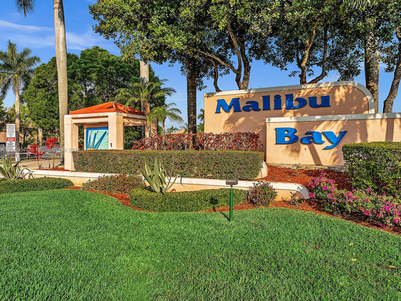 Excellent location! This spacious 3 bedroom, 2 1/2 bath townhome is located at the end of a cul de sac in the sought-after gated community of Malibu Bay!  Features include a breakfast bar in the kitchen, a new AC & water heater, walk-in closet, extra storage room, & more. Enjoy relaxing on your private screened-in patio with no neighbors behind you, and a beautiful grassy area. You can walk to the tennis courts, clubhouse, fitness center, & pool.  Excellent schools within a short walking distance.  HOA fees include roof, exterior painting, lawn maintenance, 24 hr security patrol, cable tv with high-speed internet, property management, & use of the pool, basketball courts, & walking trail at Rose Price Park.  Conveniently located close to major highways, restaurants, nightlife, & shopping!