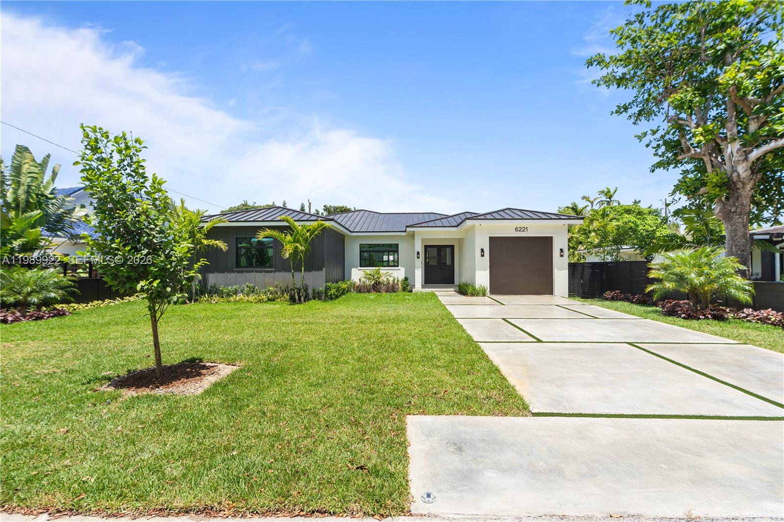 Stunning Modern Transitional new construction single-story home in the heart of South Miami. Featuring a desirable split floor plan of 2,907 sq ft of living area.  This 4BD/4.5BA residence offers open-concept living with 10-ft ceilings and oversized 63”x63” Italian porcelain floors throughout main areas. Chef’s kitchen with custom Italian cabinetry, Quartz countertops, and premium Miele appliances including gas cooktop, double ovens, wine cooler, and built-in refrigerator. Spacious pantry and abundant storage. Luxurious primary suite with spa-like bath, designer fixtures, and glass-enclosed showers. Smart home features include fiber optic wiring, monitored security system, closed-circuit security cameras, EV charger in garage, dual high-efficiency A/C systems and generator hook up ready. Private backyard with new horizontal designed wooden fence, a new 12x24 pool, marble paver deck, and lush landscaping—perfect for entertaining. Impact windows/doors, modern metal roof, functional laundry room with sink and storage, and garage. Exceptional South Miami location.