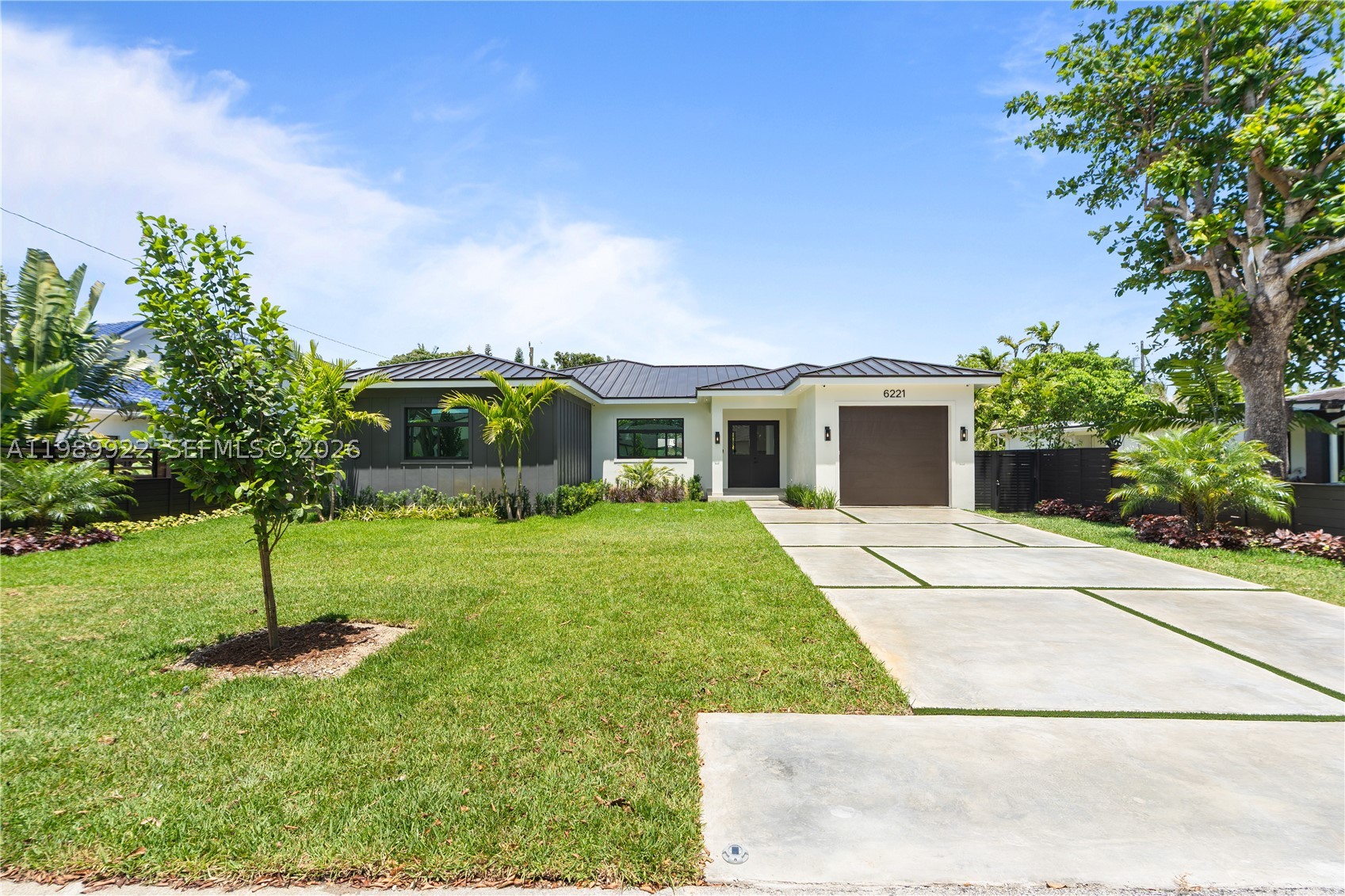 Experience luxury living in this stunning modern transitional new construction in the heart of South Miami. This thoughtfully designed single-story residence offers a desirable split floor plan of 4 bedrooms and 4.5 bathrooms, with soaring 10-foot ceilings, and oversized 63" x 63" Italian porcelain flooring throughout the main living areas. The open-concept design showcases a gourmet kitchen with custom Italian cabinetry, Quartz countertops, premium appliances with gas cooktop, wine cooler, and abundant storage. The luxurious primary suite serves as a private retreat with a spa-inspired bath featuring designer finishes and a spacious glass-enclosed shower. Additional features include a monitored security system, security cameras, dual high-efficiency A/C systems, EV charger, and generator hookup. Enjoy a private backyard oasis with a new 12' x 24' pool, marble paver patio, lush landscaping, and a modern horizontal wood privacy fence—perfect for entertaining. Complete with impact windows and doors, a sleek metal roof, a functional laundry room with sink and storage, and garage. Ideally located near South Miami's premier dining, shopping, parks, and top-rated schools, this home offers the perfect blend of luxury, comfort, and contemporary design.