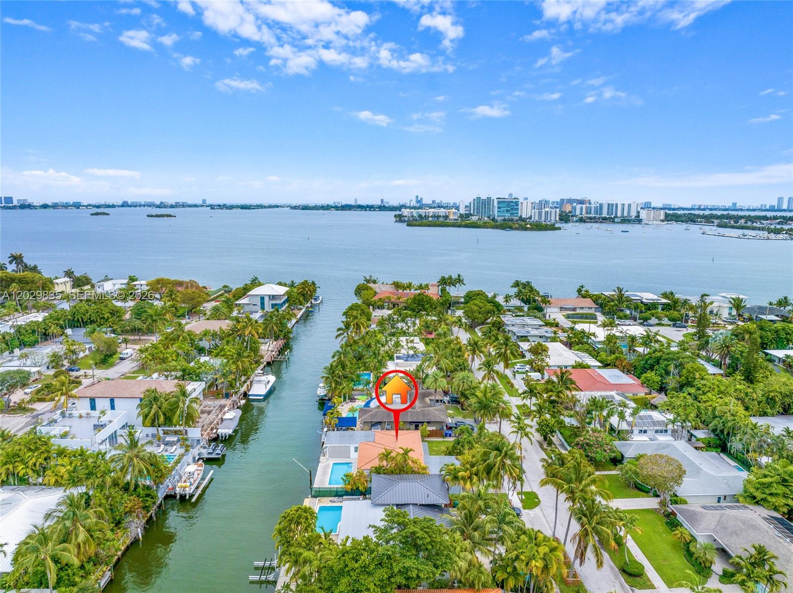 Property is on a beautifully established residential street in the exclusive Davis Harbor in Upper East Side.  I't on a wide and deep canal close to the mouth of the bay boasts 75' water frontage. Direct access to open bay with no fixed bridges.  Newer seawall with new erosion control, jet filters and a new dock in 2024.  This listing is for the land value only.  The house shows signs of settling, but seller secured the house with pilings, and voids have been filled with a warranty. All flat roofs were replaced in 2025.  Buyer can take over the renovation of the modern floor plan or build a 6,000 sf custom house from the scratch.  The [ossiblility for customization and expansion are endless. This prime waterfront is also ideally located gives you less than 20 minutes to Downtown Miami, Aventura, Miami International Airport, 10 minutes to Design District and Wynwood.