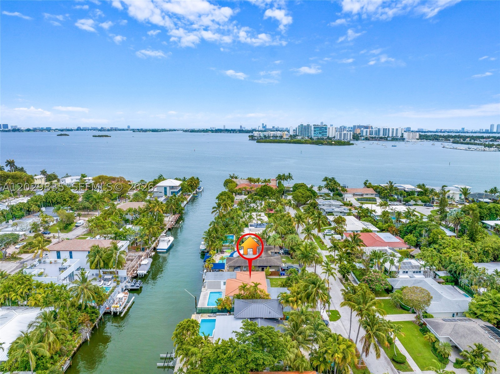 Property is on a beautifully established residential street in the exclusive Davis Harbor in Upper East Side.  Is't on a wide and deep canal close to the mouth of the bay boasts 75' water frontage. Direct access to open bay with no fixed bridges.  Newer seawall with new erosion protection, jet filters and a new dock in 2024.  This listing is AS IS.  The house had a foundation issue, but seller secured the house with pilings with a warranty. Structural engineer's report and permits package is available upon request.  All flat roofs were replaced in 2025.  All the doors and windows including garage doors are high impact proof.  Subfloor is marble ready.  Buyer can take over the renovation of this beautiful modern floor plan or build a custom house from the scratch.  Also seller could not decide how to complete landscaping and decided to leave it to the buyer.  The possibility for customization and expansion are endless. This prime waterfront is also ideally located gives you less than 20 minutes to Downtown Miami, Aventura, Miami International Airport, 10 minutes to Design District and Wynwood.