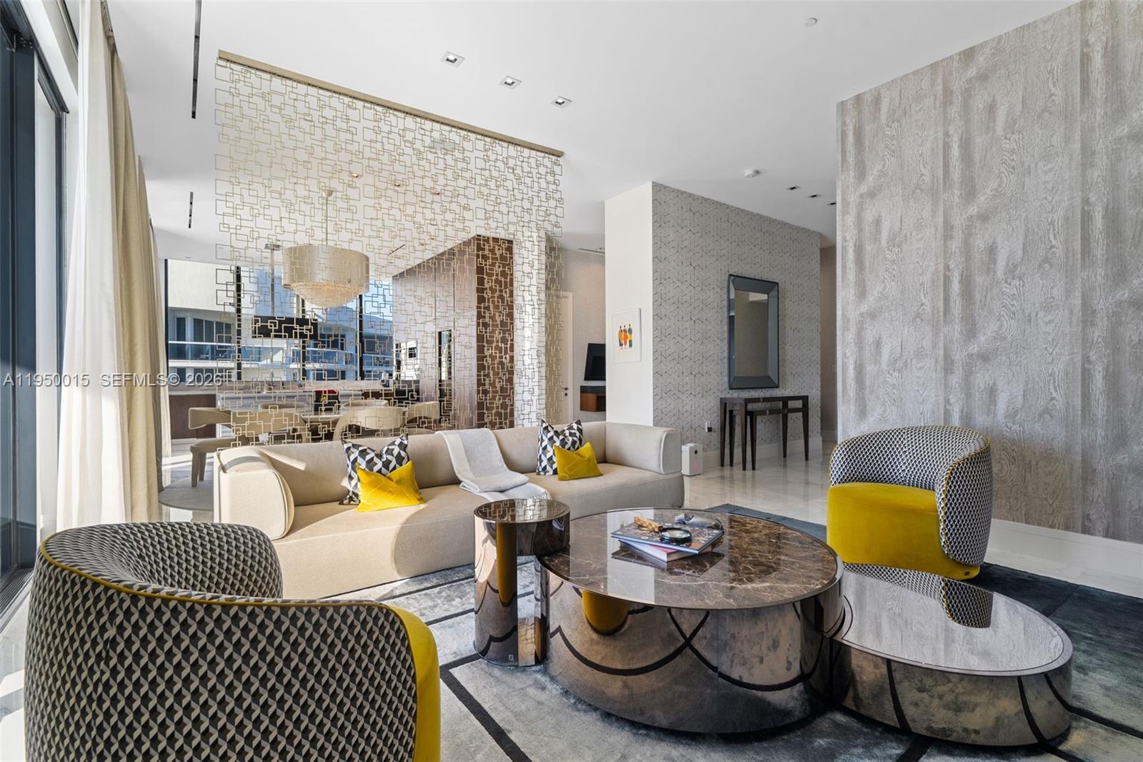 Residence 3002 at The Muse is a rare opportunity to own a meticulously curated luxury home in one of Sunny Isles Beach's most iconic boutique towers. Designed by the world-renowned architect Carlos Ott, The Muse is celebrated for its sculptural elegance , privacy, and exclusivity, with only 64 residences and two homes per floor. This Expensive residence has been completely elevated with a full Fendi casa furniture and accessories package, creating a turnkey offering where timeless Italian sophistication meets modern oceanfront living. Every detail of the interior design has been thoughtfully selected and executed, resulting in a refined, cohesive aesthetic that feels both luxurious and welcoming.
Floor-to-ceiling glass walls frame breathtaking unobstructed ocean and coastline views, flooding it with natural light and seamlessly connecting the interior to the expansive private terraces. The open-concept living and dining areas are ideal for both elegant entertaining and everyday comfort, flowing into the chef's kitchen with premium appliances and sleek contemporary finishes.
The residences features two primary bedroom suites plus an exceptionally large den, currently utilized as a third bedroom, offering flexibility for guests, family, or a private office. Each bedroom enjoys serene water views and spa-inspired bathrooms with high-end finishes, soaking tubs and designer fixtures.