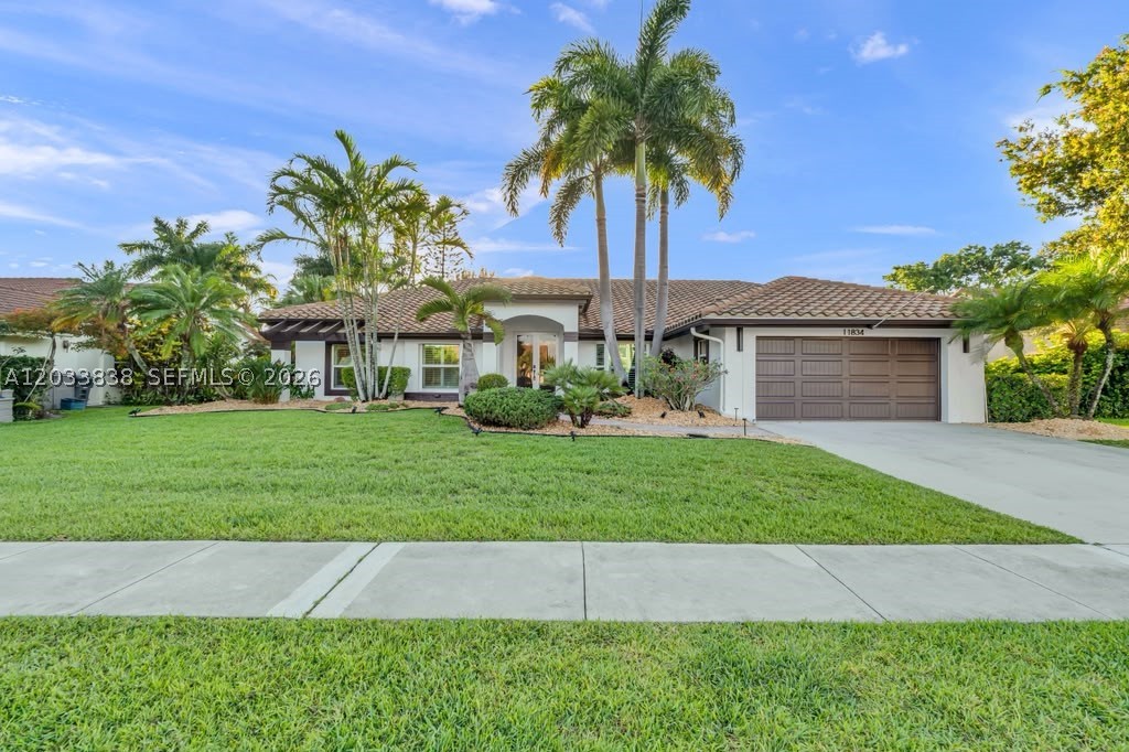 Completely reimagined and remodeled to perfection, this Luxury 4-bedroom, 2.5-bathroom Boca Raton Residence offers 2,595 square feet of true move-in-ready Luxury inside the Gated Island Lakes Community. Bright open living spaces, sleek modern finishes, and a designer kitchen with a massive island create an immediate wow factor from the moment you enter. The home offers a refined primary suite, spacious secondary bedrooms, and a private backyard ideal for entertaining, relaxing, and enjoying the South Florida lifestyle. Modern, elegant, and beautifully Designed, this rare Island Lakes opportunity feels like a brand-new luxury home in one of West Boca’s most desirable gated neighborhoods.