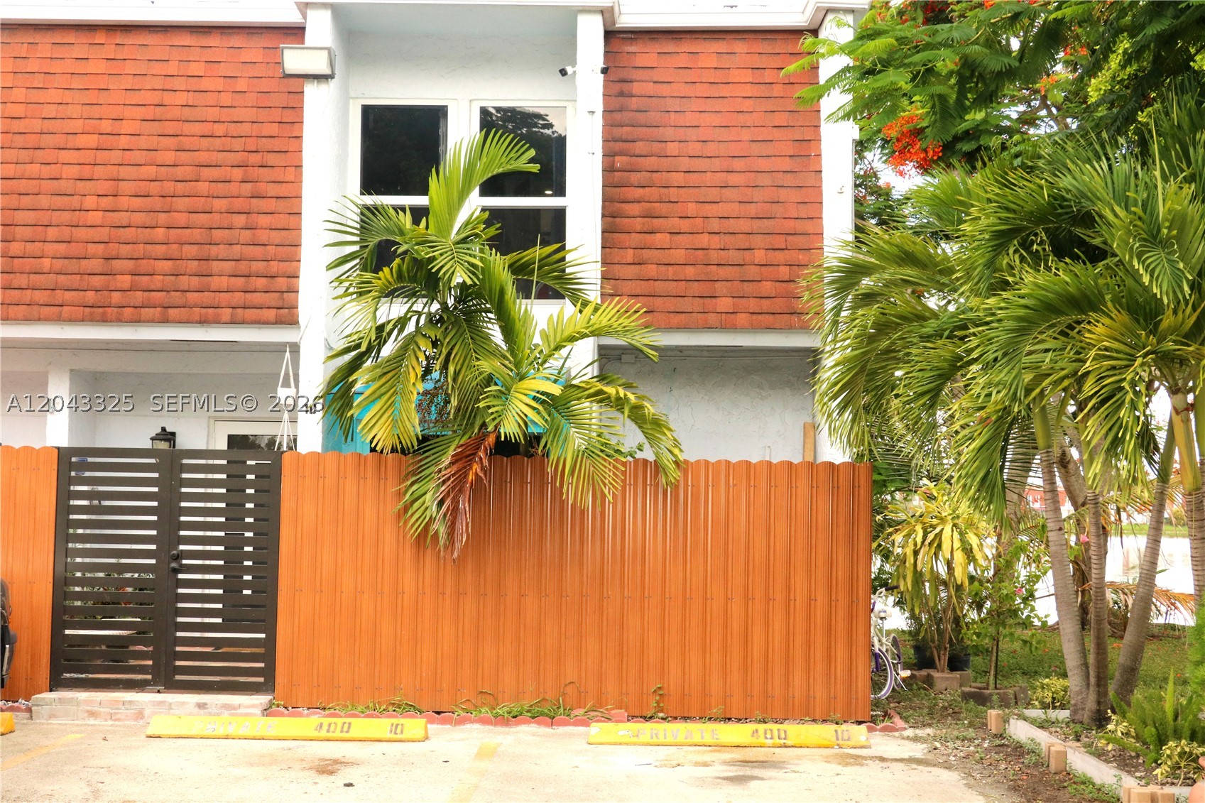 Charming lakefront 3-bedroom, 2.5 bath corner townhome featuring impact windows and doors throughout. The updated kitchen offers granite countertops and overlooks spacious living areas. Enjoy relaxing on the covered terrace with a private wood deck providing direct access to the lake. The desirable corner unit includes three assigned parking spaces and is conveniently located near the Florida Turnpike, SR-836, and FIU, with easy access to shopping, dining, and schools. A rare opportunity to enjoy waterfront living in a prime location.