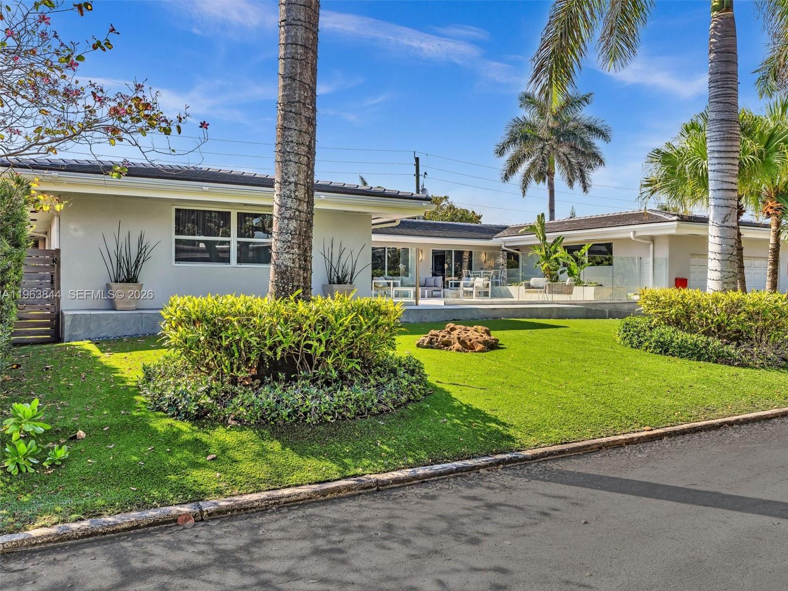 Experience luxury living in this Spacious and beautifully renovated 4 bed, 4.5 bath home in Hollywood Lakes. Offering over 4,800 sq. ft. with waterfront views and a short stroll to Southlake. Key features include a Sub-Zero refrigerator, 3 high-efficiency A/C units, a whole-house generator, newer roof, and impact windows/doors that fill the home with natural light. The spa-like wet room with MTI soaker tub adds a touch of luxury. Outdoors you'll enjoy a fenced backyard with an expansive screened patio/pool combination and large oversized patio in the front with a 2 car garage. Perfect as a primary residence or Airbnb. Walking distance to the beach, Hollywood Broadwalk, and only 10 minutes from Fort Lauderdale Airport. this home truly delivers the ultimate South Florida lifestyle.