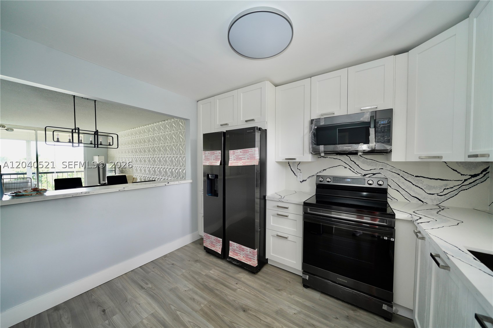 Modern, completely remodeled 1 bedroom, 1.5 bath condo which includes brand new Samsung black stainless steel appliances, quartz countertops, cabinets, lvp flooring, 5" baseboards, vanities, 3D accent wall. You have the option to buy it completely furnished as pictured, with TV, power reclining sofa and recliner, dinning table and chairs, queen bed. This 55+ community offers amenities, including a pool, BBQ area, clubhouse, gym and sauna. Cable TV and Water are included. The condo is located only 10 minutes from Sawgrass Mills Mall and short distance to restaurants and supermarkets. At least one buyer needs to be 55+. No Association credit or income requirements.