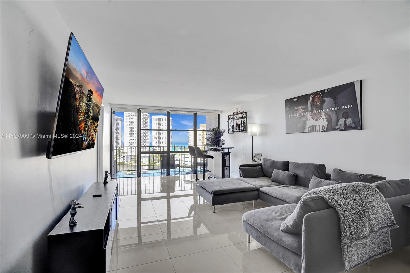 MODERN 2/2 ON THE INTRACOASTAL WATERWAY.  DRAMATIC VIEWS FROM ABUNDANT WINDOWS - LOOKS LIKE AN ICONIC WATERFRONT VISTA.  LOCATED IN HALLANDALE CLOSE TO SHOPPING AND RESTAURANTS. THIS UNIT IS FULLY FURNISHED WITH A HOME OFFICE OR SECOND BEDROOM.  PRIMARY SUITE OFFERS OVERSIZED TUB/SHOWER,  EXTRA LARGE WALK-IN CLOSET AND PERSONAL SAUNA!  KITCHEN HAS ALL APPLIANCES AND HOUSEWARES.  LARGE LIVING SPACE WITH DINING AREA, BAR AND LED FIREPLACE. GORGEOUS WHITE PORCELAIN FLOORS. AMENITIES INCLUDE LARGE GYM FACING THE WATERFRONT AND OLYMPIC SIZE SWIMMING POOL!  ASSIGNED PARKING SPOT, 24 HOUR SECURITY BIKE STORAGE AND PARTY ROOM.  MAKE AN APPOINTMENT TODAY.