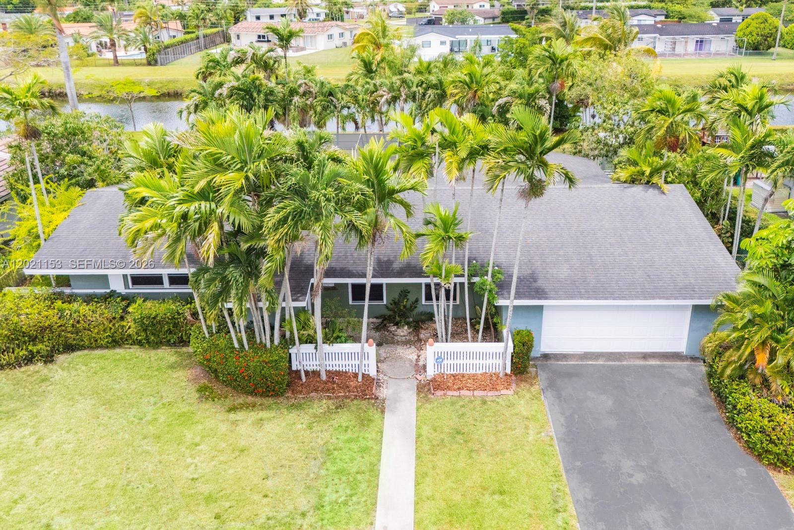 Incredible opportunity in centrally located Baptist area with easy access to all freeways and all of Miami.  Wonderful family home lovingly maintained and lived in for many years features 3/2 (extra large 3rd bedroom can be converted back to a smaller 4th bedroom), screened in pool-patio, and plenty of yard leading to nice canal privacy and view.  Shingle roof, 2-car garage, terrazzo floor foundation, and more!  Great neighborhood and nice wide canal front!!