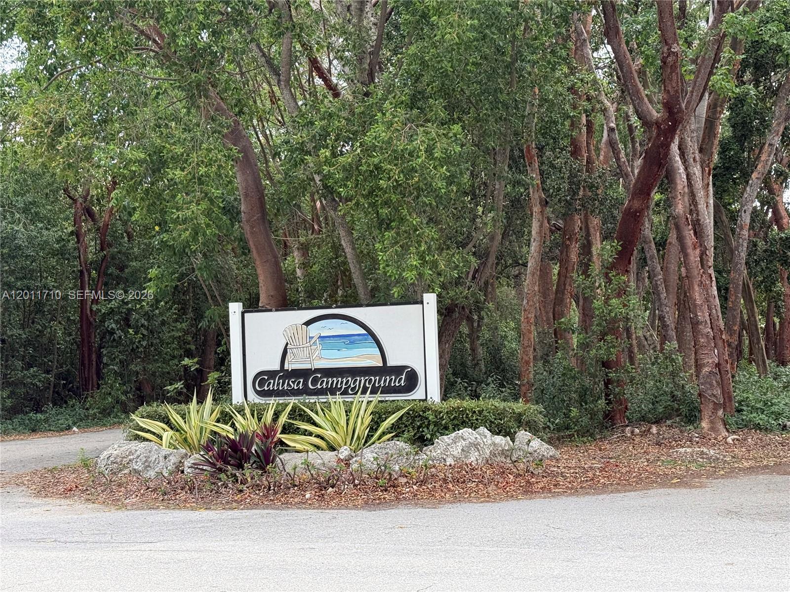 Priced to Sell ! Spacious 1750 sq ft lot in desirable Calusa Campground, Key Largo. Discover your slice of paradise in the highly sought- after community. Fully set up for comfort, relaxing and convenience. Property features a well maintained trailer that sleeps up to 10, paver and tiled surfaces throughout, covered carport/patio ideal for outdoor living and utility shed for extra storage.  Enjoy resort style amenities: boat launch, golf-cart friendly streets, swimming pool, clubhouse, laundry facility, tennis, basketball, children’s playground, picnic area and beautiful bay front Sunsets. Lot is rentable for short-or long term stays. The perfect Key's retreat or income-producing property