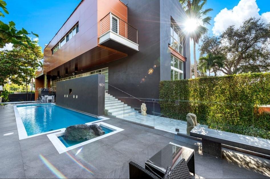Stunning modern residence on prestigious South Bayshore Dr. Nearly 4,000 SF with double-height ceilings, walls of glass, and abundant natural light. Features European-style kitchen, high-end appliances, wet bar, and private pool with lush landscaping. Prime location near Coconut Grove, marinas, dining, and parks. Furniture Negotiable, Contact Listing Agent for Showing Availability! Won't Last!