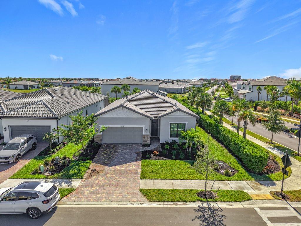 Owner says SELL! Welcome to your brand-new home in Ave Maria! Built in 2025, this beautifully designed Cedar floorplan perfectly situated on a desirable corner lot. From the moment you arrive, you’ll notice the thoughtful upgrades that set this home apart, including sleek aluminum fencing, enhanced outdoor lighting, and a professionally finished epoxy garage floor. Inside, the open-concept layout is both functional and inviting, featuring tile flooring throughout the main living areas and plush carpet in the bedrooms for added comfort.
The modern kitchen is a standout, complete with quartz countertops, an upgraded configuration, and a generous walk-in pantry—perfect for storage and everyday convenience. The primary suite offers a peaceful retreat with a spacious walk-in closet and well-appointed bath.
Step outside to your extended covered lanai, ideal for relaxing or entertaining year-round while enjoying the Florida lifestyle.
Living in Ave Maria means access to an incredible array of amenities. Enjoy nearby parks and recreation, including North Park with sand volleyball, soccer and baseball fields, basketball courts, playgrounds, and shaded picnic areas. Cool off at the Ave Maria Water Park, featuring a resort-style beach-entry pool, lap lanes, waterslides, and a kids’ splash zone. South Park offers even more, with a dog park, softball fields, bocce and pickleball courts, plus scenic walking and biking trails.