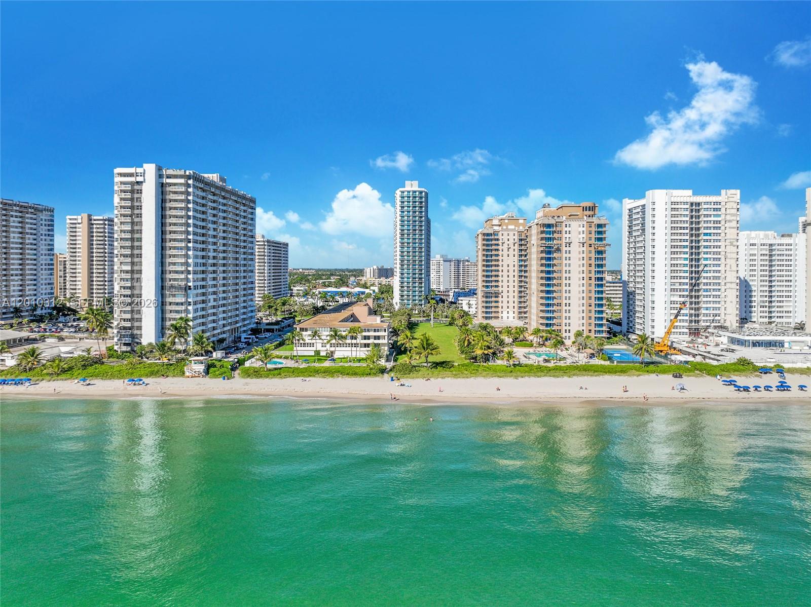 Experience refined waterfront living in this exceptional Intracoastal residence in Hallandale Beach, Florida, perfectly positioned across from the ocean. Enjoy sweeping water and skyline views in a serene setting where luxury meets coastal elegance. This well-maintained residence offers higher ceilings, a spacious open-flow design, and timeless finishes that create an atmosphere of comfort and sophistication. Every detail reflects effortless South Florida living at its finest. Indulge in resort-style amenities including 24/7 concierge service, valet parking, heated waterfront pool, state-of-the-art fitness center, elegant clubhouse, business center, and private marina access. Ideally located just moments from Aventura, Golden Beach, and Hollywood Beach, with easy access to Miami and Fort Lauderdale. A short drive connects you to world-class destinations including Gulfstream Park, Diplomat Golf & Tennis Club, fine dining, entertainment, and luxury shopping. Convenient proximity to Fort Lauderdale-Hollywood International Airport, Miami International Airport, Port Everglades, and PortMiami ensures seamless travel access. Perfect as a primary residence, seasonal retreat, or investment in one of South Florida’s most desirable waterfront communities. Live where others vacation—surrounded by water, sunshine, and the true essence of coastal luxury.