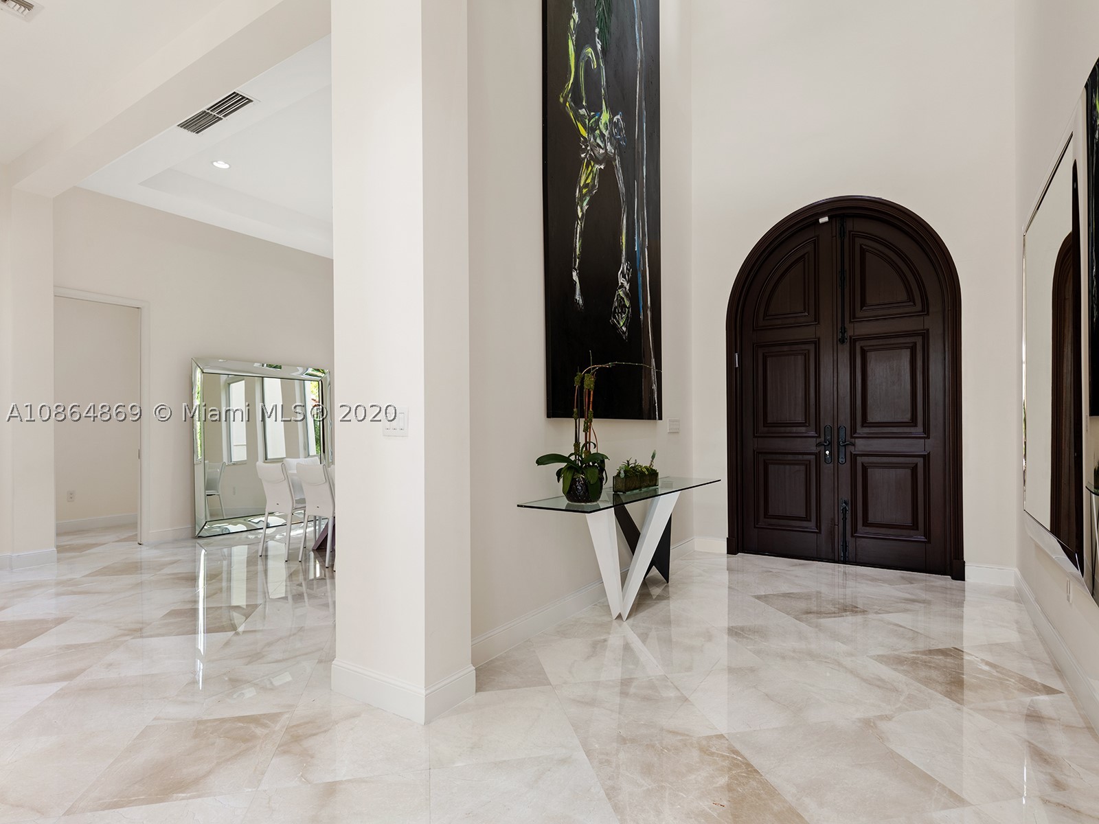Coveted Bay Harbor Islands Waterfront. This luxurious custom built Mediterranean estate w/ contemporary design is nestled on a 16,875 sf lot w/ mature foliage offering complete privacy. The residence features magnificent foyer entry w/ 24' coffered ceilings welcoming you to an open living room offering stunning views of the outdoors. 6bd/6.5ba, marble & hardwood floors, chef's kitchen, top-of-the-line appl, formal dining, media room, grand master suite leaves nothing to be desired w/ double door entry, 2 closets, huge master bath & terrace. 113' of waterfront w/ huge protected dock allowing for easy bay & ocean access within minutes. Huge outdoor area surrounds the opulent Jacuzzi & pool, ideal for Florida entertaining at its finest! You could not pick a better community to call home!