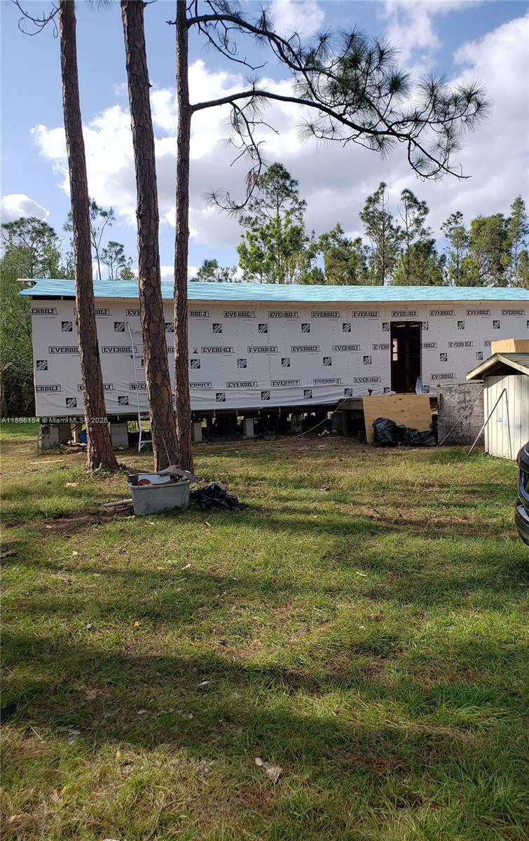 This is a distressed manufactured home and will require considerable improvements or removal. The property is over 3/4 of an acre and abuts a currently wooded area providing abundant privacy and quiet. Located in unrestricted LEE County (North Fort Myers) this oversized lot with electric, well, septic and paved driveway is a recreational vehicle owner's dream! Home is currently uninhabitable. Investment Opportunity for a rural feel, with the accommodations of the City.
This property has county violations and is being sold AS-IS. Buyer to do their own due diligence.