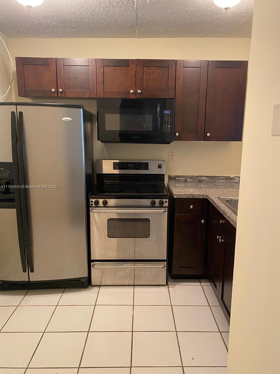 Spacious 1/1 unit located on the 3rd floor. Kitchen features wood cabinets, granite counter tops, stainless steel refrigerator and electric range. Large living area and balcony. Gated community with 24/7 security guard at gate, pool, laundry facilities on every floor, tennis court. 1 assigned space + guest parking (additional spaces can be rented from the Association). Pets allowed. Ask about restrictions. Association requires a $1,000 refundable security deposit during the application process.