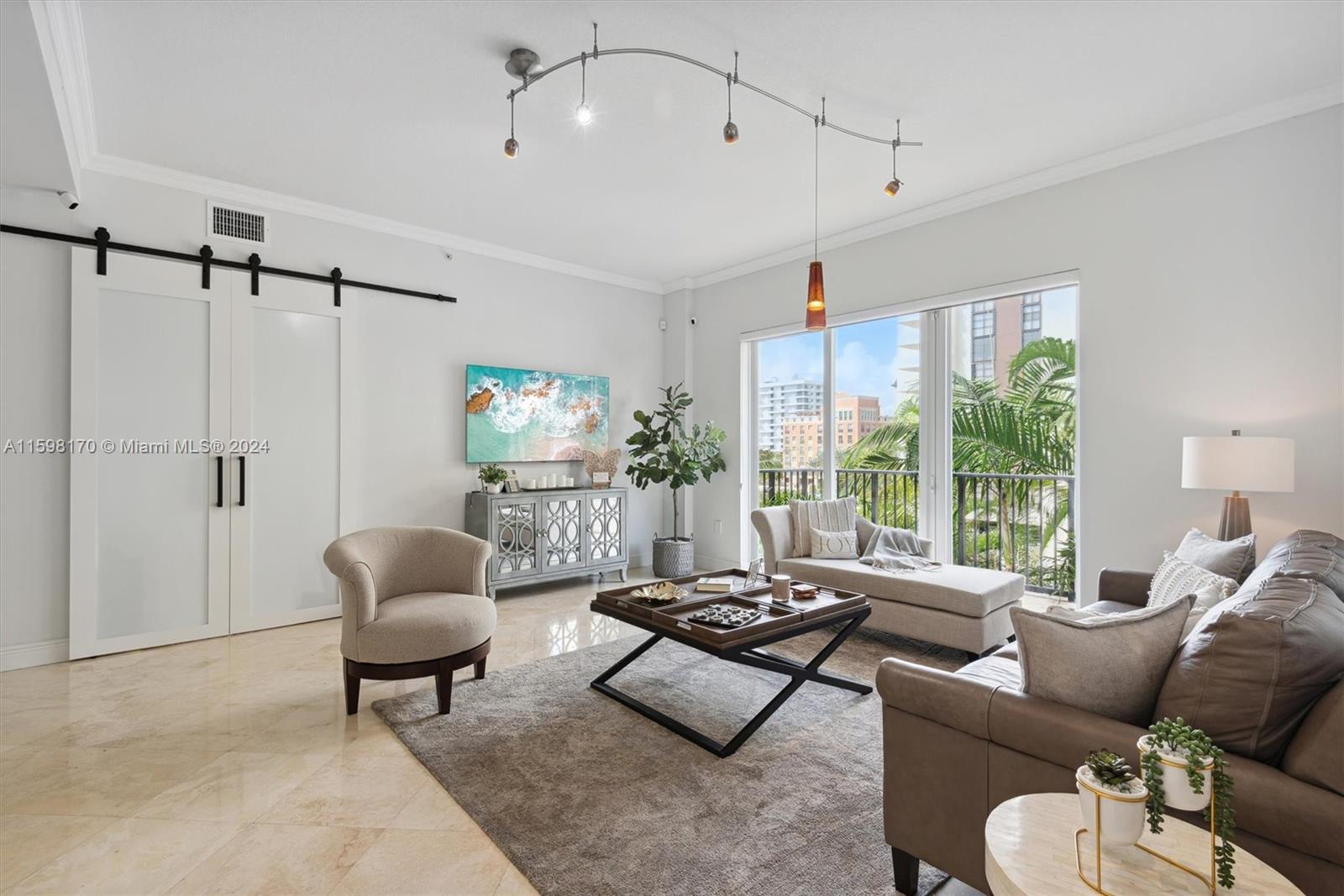 Welcome to luxury living at 642 Valencia Ave, Unit 405 in the heart of Coral Gables! This stunning 3-bedroom, 3-bathroom condo offers 1,932 sq ft of elegant living space with high ceilings and impact windows. The spacious master bedroom features a generous walk-in closet and en-suite bathroom. Enjoy the convenience of a dedicated laundry/utility room and two assigned parking spots. Step out onto your private terrace and take in the breathtaking views of Coral Gables. Located in a highly desirable area, you'll be close to top-rated schools, upscale dining, shopping, and entertainment. Don’t miss the chance to make this exceptional condo your new home!