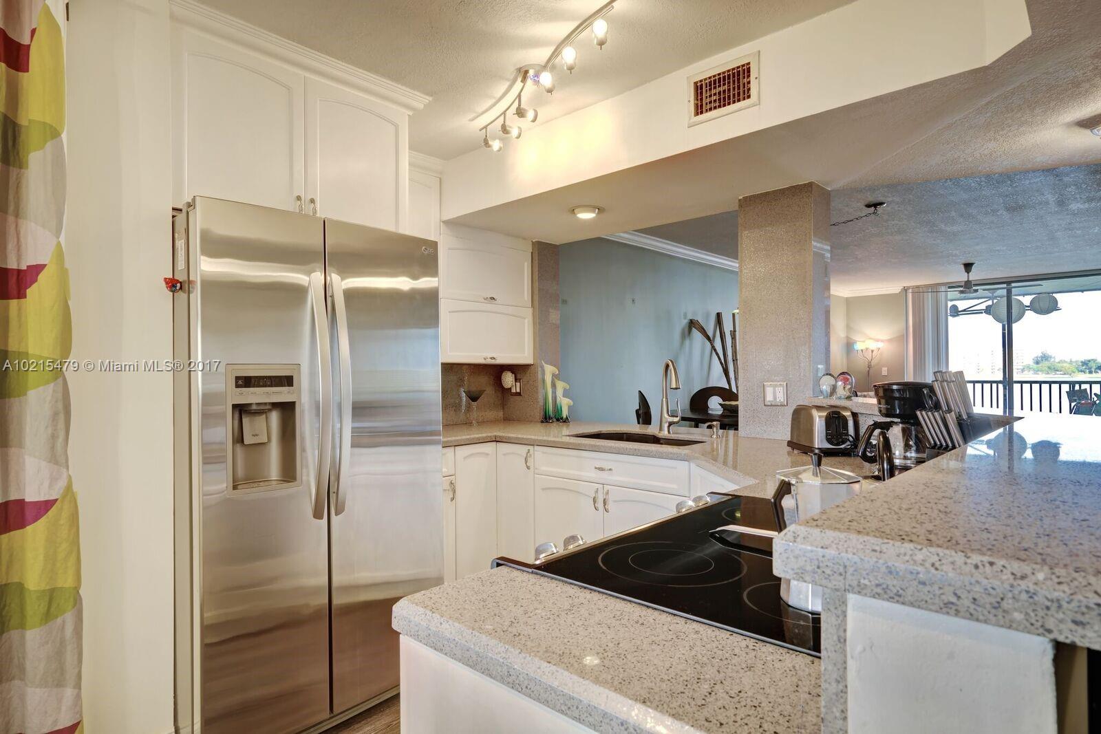 Large 2/2 with open gourmet kitchen chef ready with LG appliances, quartz counters and custom island. Views of the 168 acre lake from kitchen, living/dining and master. Expansive Master with luxurious custom bath and walk-in closet with 12x8 screened balcony. Large 2nd master with semi private bath, with garden views, W/D in unit. Gated Community, 24 hour security, 3 heated pools & spas, fitness center, tennis courts, 2 miles of walking and biking paths, cable and water included in HOA Fees, 2 small pets.