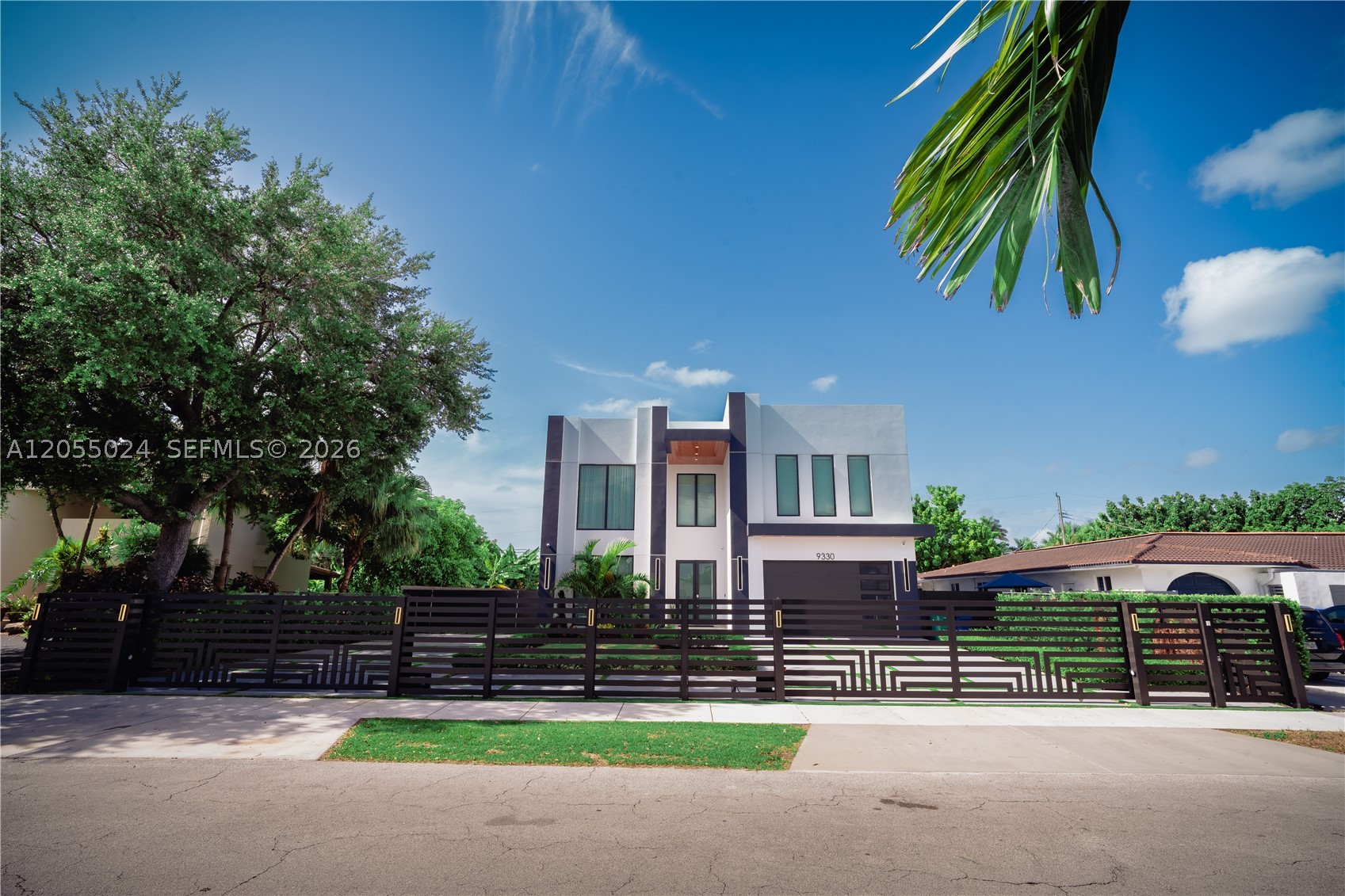 Welcome to your private luxury retreat in the heart of Miami. This newly built modern home offers the perfect blend of elegance, comfort, and convenience, just minutes from Coral Gables, Doral, Miami International Airport, and the city's best dining, shopping, and attractions. This spacious home features 4 Bed and 5 full baths, with each bedroom offering its own private en-suite bathroom for added comfort and privacy. The bright open-concept living area showcases soaring ceilings, designer finishes, and expansive windows that fill the home with natural light. The gourmet kitchen is equipped with premium stainless steel appliances, custom cabinetry, and a large island—perfect for cooking and gathering. The main floor includes a guest bedroom/home office and a cabana bath with direct access to the backyard. Upstairs, the luxurious primary suite features a private balcony, spa-inspired bathroom, and spacious walk-in closets. The home also offers two laundry rooms (one on each floor), a two-car garage, and an oversized 11,000 sq. ft. lot with room to park a boat, RV, or multiple vehicles. Step outside to your private backyard oasis with a sparkling pool, covered outdoor lounge with TV, outdoor kitchen, BBQ, and beautifully landscaped spaces designed for relaxing or entertaining. Located just blocks from Christopher Columbus High and St. Brendan High, this exceptional home is perfect for families, business travelers, and extended stays looking to experience Miami in luxury.
