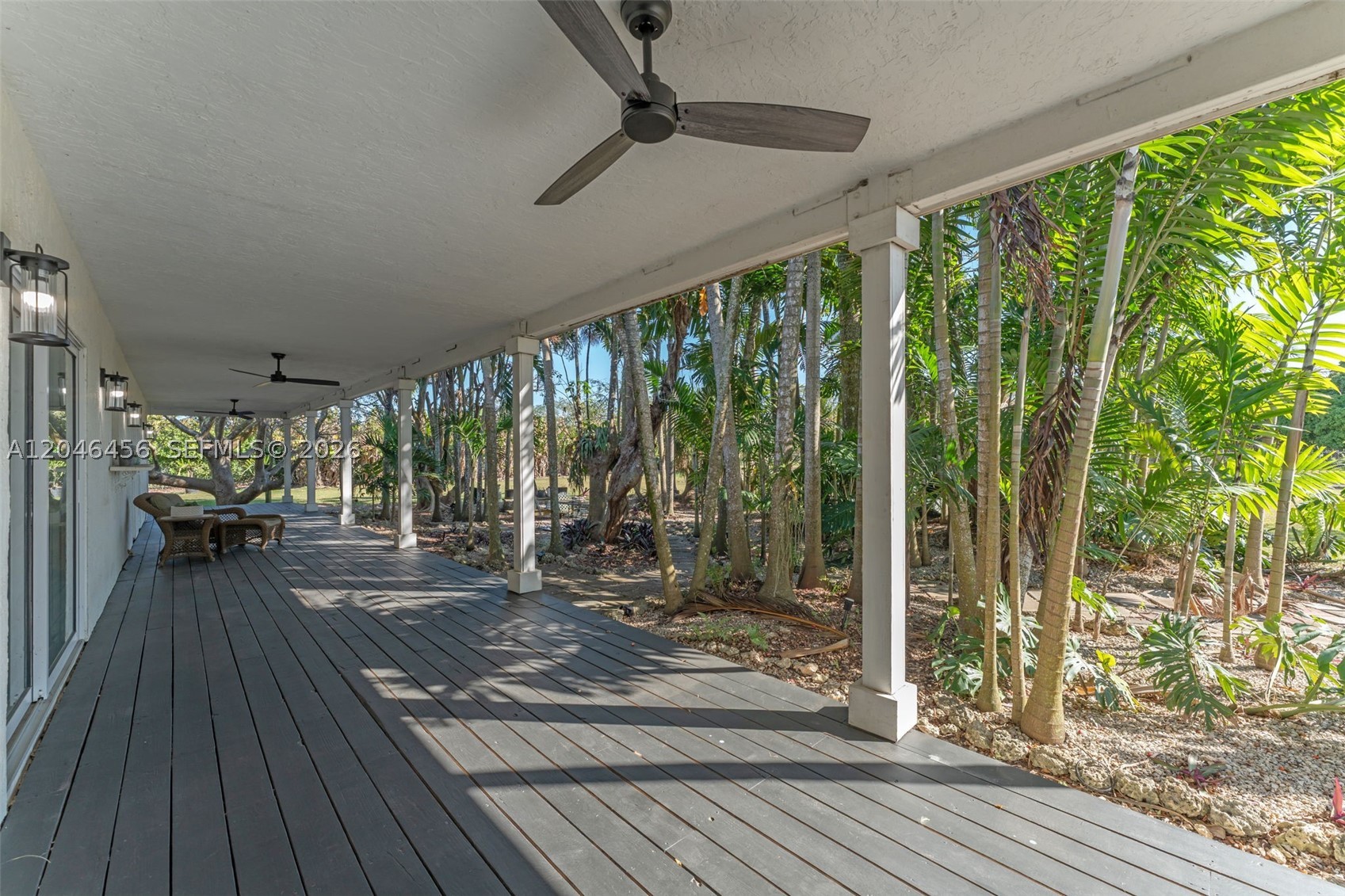 2.55 ACRE 4/2 FARM HOUSE W/WRAP AROUND PORCH, 6 CAR GARAGE, A Saloon OUT OF WILD WEST, 1/1 IN LAW, INCOME LYCHEE AND PLAINTAIN GROVE , & POLE BARN. A LONG  TREELINED DRIVEWAY LEADS INTO THE  COMPOUND. THE HOUSE IS A 4/2 GREAT ROOM WITH A WOOD BURNING FIREPLACE. THE PIECE DE RESISTANCE IS THE 3/4 10' WIDE WRAP AROUND W/ NEW FANS & CUSTOM LIGHTING. EVERY ROOM OPENS ONTO THE PORCH.PROPERTY BACKING UP TO A FISHABLE CANAL. ALL NEW IMPACT DOORS & WINDOWS, STEEL FRAME CONSTRUCTION, CONCRETE SLAB. FRUIT TREES ON SITE LYCHEE, 13 BANANA/PLAINTAIN TREE'S, POTTED DRAGON FRUIT, AVOCADO, MANGO, STAR FRUIT, LONGAN TREE WITH OPEN PASTURE TO PLANT MORE OR ???. THERE IS POWER TO GATE , PAVED ROADS, NORTH SOUTH FRONTAGE.. CLOSE TO KENDALL AND THE FL KEYES. LOCATED BETWEEN 2 NATIONAL PARKS BISCAYNE AND THE EVERGLADES. THIS IS A BEAUTY