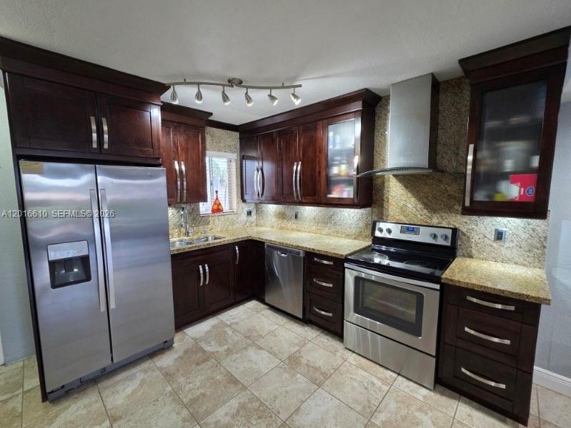 Beautiful and spacious 2-story townhouse condo located in the desirable Terrazas Del Sol community in Hialeah. This well-maintained unit features 2 bedrooms and 1.5 bathrooms, an updated kitchen with stainless steel appliances, remodeled bathrooms, tile flooring on the main level and laminate wood floors upstairs. Enjoy two private balconies, plenty of natural light, and an open living/dining area perfect for entertaining. Assigned parking plus guest parking available. Centrally located near major highways, shopping centers, restaurants, and schools. Roof replaced in 2025 by the association. Easy to show.