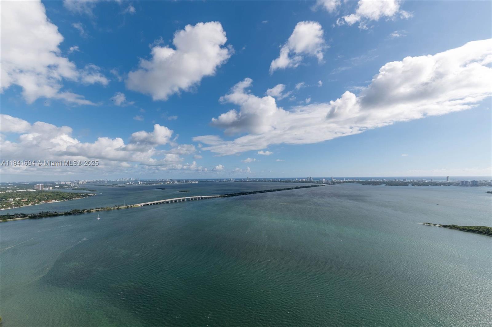 Experience the pinnacle of modern luxury at Aria Reserve—Miami’s most anticipated new waterfront address. This brand-new 2025 residence offers three bedrooms plus a den, with meticulously designed interiors and a sprawling terrace showcasing breathtaking 50th-floor views from Biscayne Bay to the Atlantic. The open layout is anchored by a sleek gourmet kitchen with top-of-the-line appliances and upgraded engineered stone countertops. Additional upgrades include a dropped ceiling in the living/dining room and primary suite, trimless lighting, frameless doors, elegant window treatment. This home includes two adjacent parking spaces—a rare and valuable convenience. Please look at attachments for a complete description of all upgrades.
