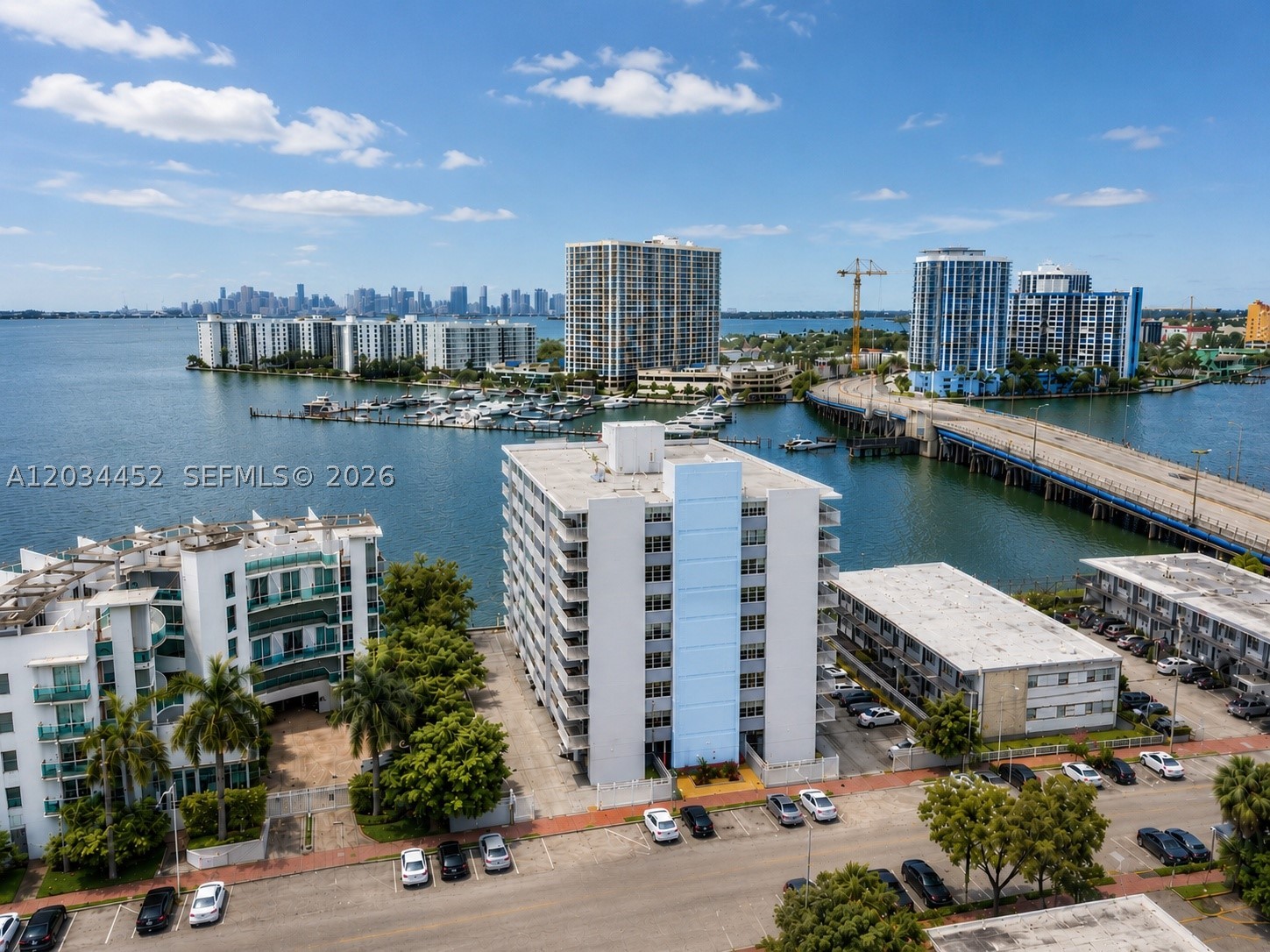 Experience the best of both worlds on the border of Miami Beach and North Bay Village. This spacious 2-bedroom, 2-bathroom corner unit offers expansive Biscayne Bay views, sweeping water vistas, and stunning Miami skyline views from both bedrooms & living room. The primary suite features a walk-in closet, while the updated kitchen is equipped with stainless steel appliances. Washer and dryer hookup available in the unit.

The building has recently undergone significant improvements, including new elevators, fresh exterior paint, and hurricane-impact windows. Additional enhancements are underway, with plans for a renovated parking area and the installation of a new secured entry gate. The building has also successfully completed its 50-year recertification, providing added peace of mind for owners and investors alike.

Residents enjoy access to a private bayfront pool, fitness center, and covered assigned gated parking conveniently located near the secured building entry.  Ideally situated just steps from shopping, grocery stores, Normandy Pool & Park, bayfront tennis courts, and more. Whether you're looking for a primary residence, second home, or investment opportunity, this waterfront property offers an exceptional lifestyle in a prime location.