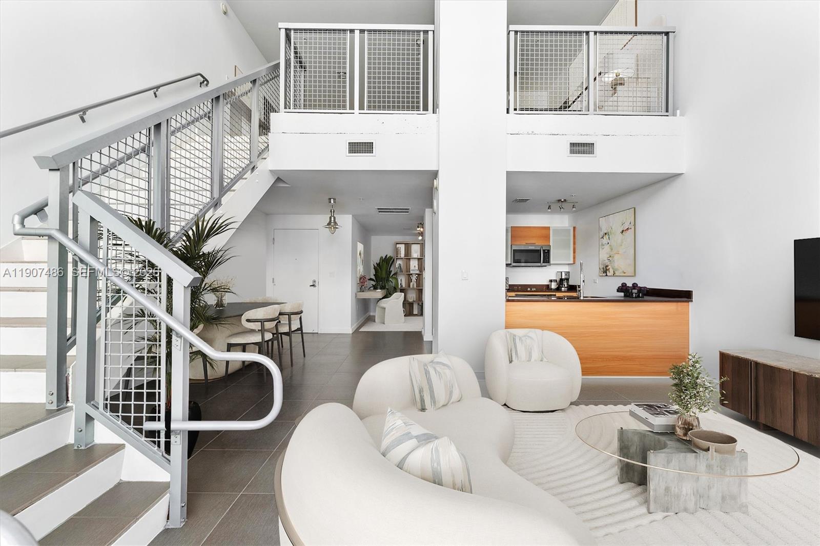Welcome to Unit M0502 at Four Midtown Condo – a true loft living experience with soaring 30-foot ceilings and expansive windows that bathe the space in natural light. This 1-bedroom plus a versatile second bedroom/den, two-story loft is priced to sell and offers exceptional value in the heart of vibrant Midtown Miami. On the first floor, you’ll find the flexible second bedroom, currently styled as a home office, offering plenty of potential as a den, guest space, or creative retreat. 

This unit also features sleek stainless steel kitchen appliances, a spacious terrace perfect for unwinding or hosting friends, and has with 1 assigned parking space in a covered garage. Upstairs, the expansive primary bedroom provides privacy and comfort in a serene setting. Thinking ahead and wanting more livable space? Expand the second floor to add up to 400 SqFt! 

4 Midtown is a full-service condominium that features a newly redesigned lobby, a state-of-the-art fitness center, and beautifully updated common areas, all within a pet-friendly community. Enjoy unparalleled convenience with some of the finest restaurants, shops, and nightlife right at your doorstep in Midtown, Wynwood, and the Miami Design District.