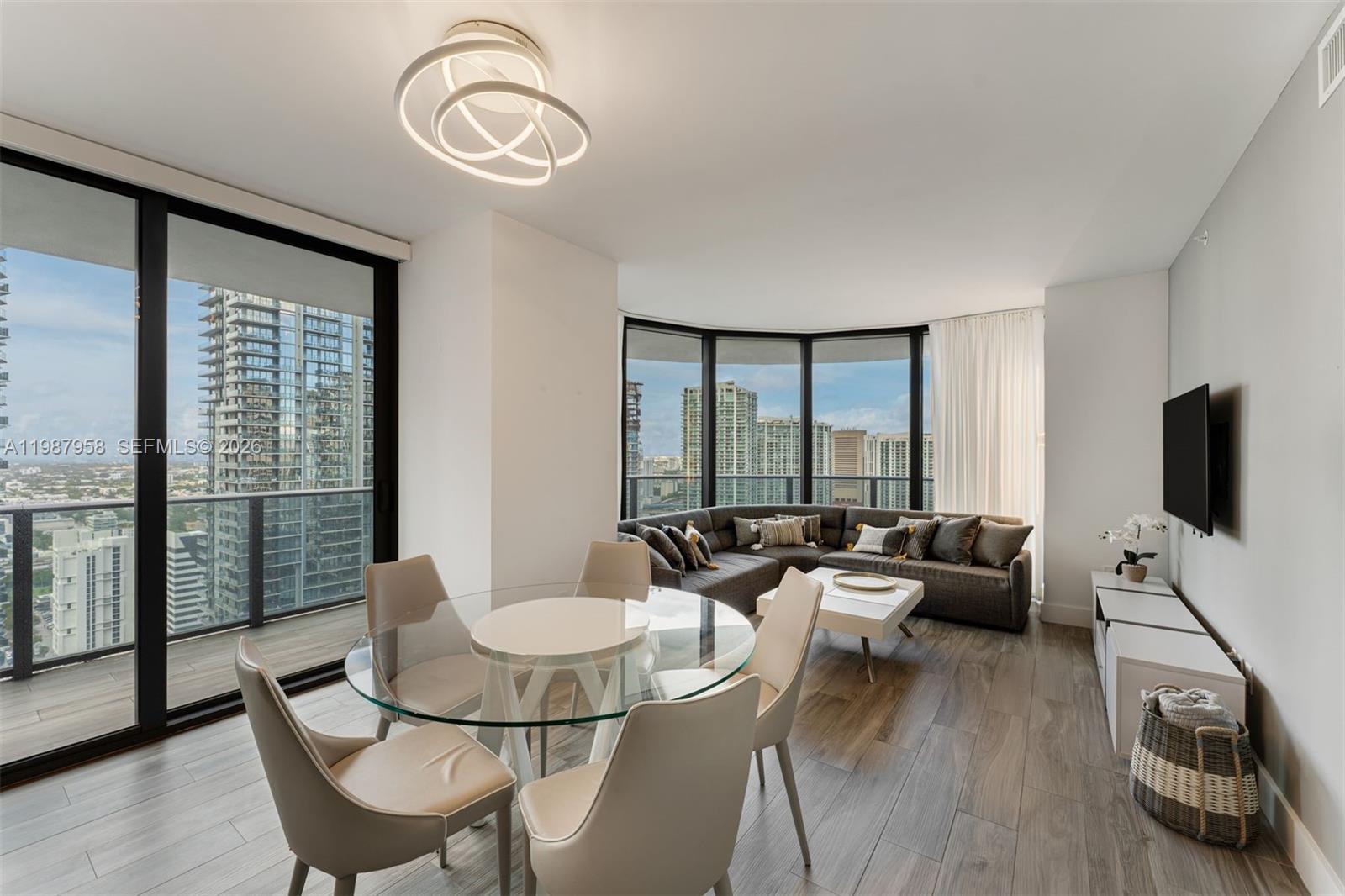 High Floor 3-bedroom residence at SLS Lux. This stunning home features northwest-facing views overlooking Brickell City Centre, the Miami River, and breathtaking sunsets. The open-concept kitchen is equipped with top-of-the-line Sub-Zero refrigeration, Wolf appliances, custom Italkraft cabinetry, and sleek white quartz countertops. The spacious floor plan offers 3 bedrooms and 3 bathrooms, complemented by a large wraparound balcony ideal for indoor-outdoor living. The primary suite includes a spa-inspired bathroom with double vanities, a separate soaking tub and glass-enclosed shower, and a generous walk-in closet. Ideally located steps from Mary Brickell Village and Brickell City Centre, residents enjoy world-class amenities including a 9th-floor resort-style pool with cabanas, state-of-the-art fitness center, resident lounge, kids’ playroom, tennis courts, basketball and more. Additional exclusive amenities include a 45th–46th floor sky lobby with private terrace, jacuzzi, and a rooftop pool reserved exclusively for residents.