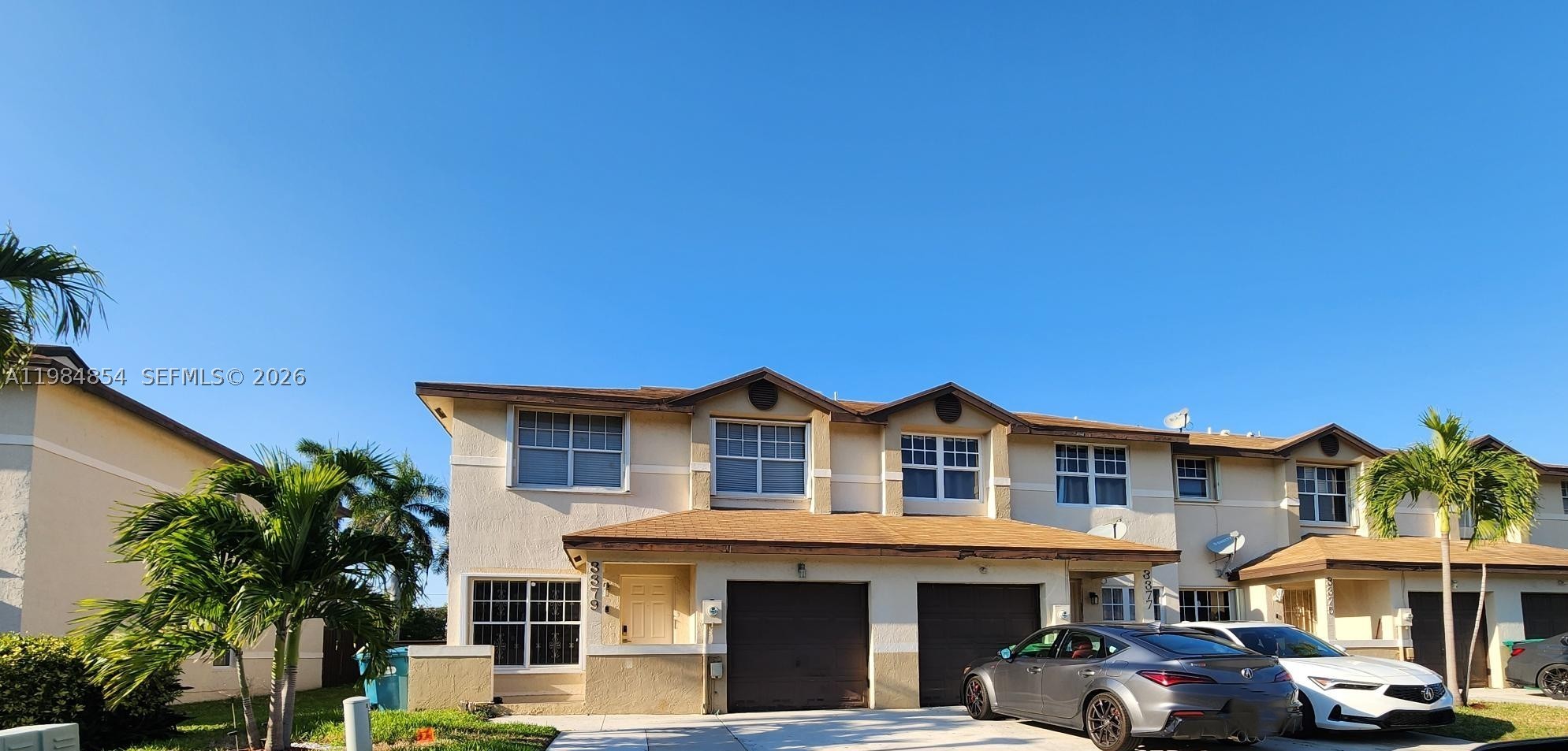 Beautifully maintained corner-unit townhome offering 1,618 square feet of comfortable living space in a gated community. This spacious 4-bedroom, 2.5-bath residence features an open-concept layout with tile flooring throughout the main living areas, crown molding, zebra blinds, and a kitchen highlighted by granite countertops. Enjoy outdoor living on the private tiled patio with pergola, perfect for relaxing or entertaining guests. Upstairs, you'll find wood flooring throughout four generously sized bedrooms, including a spacious primary suite with a private ensuite bathroom. Ideally located near Hard Rock Stadium, major highways, shopping, dining, and the Florida Turnpike, this move-in-ready home offers convenience, comfort, and value. Whether you're searching for your first home, forever home, or an investment opportunity, this property is a must-see. Seller is offering $5,000 toward buyer closing costs.