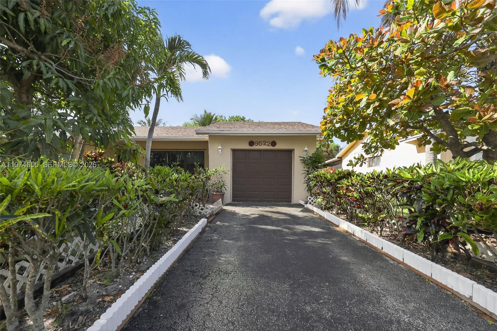 Tropical Living in the Heart of Boca Raton
Discover the perfect blend of comfort and convenience at 9522 Affirmed Lane, a charming 3-bedroom, 2-bathroom residence spanning 1,266 square feet. Situated in a prime, central location, this home offers a rare opportunity to enjoy the sought-after Boca Raton lifestyle at a reasonable cost with impressively low HOA fees.
Interior Highlights
The heart of the home features a stylish open-concept kitchen designed for both functionality and entertaining. It flows seamlessly into the dining area and boasts:
Modern stainless steel appliances.
Elegant wood cabinetry and a classic tile backsplash.
Cohesive tile flooring throughout the entire home for easy maintenance.
Updated ceiling fans and integrated lighting in the dining and bedroom areas.
The primary suite serves as a private retreat, featuring a master bath equipped with a custom vanity, updated fixtures, and a dedicated stand-up shower.
Florida Living at Its Finest
Enjoy the best of the Sunshine State in the enclosed Florida room. This space is completely open to the rear, flooding the home with natural light and providing a serene transition to the outdoors.
The backyard is a tropical oasis, featuring:
Lush, professional landscaping.
Mature mango trees for a true taste of South Florida.
A spacious yard that offers plenty of privacy and room to breathe.