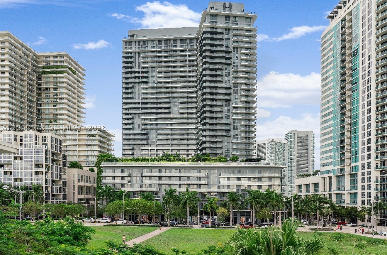 Rarely available, fully upgraded 1-bedroom, 1.5-bath residence at Hyde Midtown offering approximately 817 sq. ft. of interior living space, including a professionally enclosed and covered 75 sq. ft. balcony that seamlessly extends the living area. This exceptional residence features a custom center kitchen island, premium ItalKraft cabinetry imported from Italy, white quartz countertops with full-height backsplash, under-cabinet lighting, and a complete suite of GE Monogram paneled appliances. Upgraded porcelain wood-look tile flooring by Cerdomus flows throughout the residence and continues onto the enclosed balcony for a sophisticated, seamless design. Floor-to-ceiling impact glass, contemporary finishes, and an open-concept layout complement Hyde Midtown’s resort-style amenities, including a pool, fitness center, spa, tennis court, concierge, valet, and 24-hour security. Located in the heart of Midtown Miami, just steps from the Design District, Wynwood, premier dining, shopping, Trader Joe’s, and Target. Investor-friendly with 30-day minimum rentals permitted up to 12 times per year.