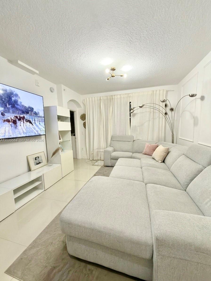 This gorgeous updated 3-bedroom, 2-bathroom condo located in the highly sought-after gated community of The Courts at Doral Isles. This spacious first-floor residence offers 1,271 square feet of comfortable living space with an open-concept layout, and some modern finishes throughout.

The well-appointed kitchen seamlessly connects to the living and dining areas, creating the perfect space for everyday living and entertaining. The primary suite features a walk-in closet and an updated en-suite bathroom, while the additional bedrooms provide flexibility for family, guests, or a home office.

Enjoy the convenience of in-unit laundry, and a private balcony. Residents have access to the swimming pool, playgrounds, and common areas.

Ideally located in the heart of Doral, close to top-rated schools, shopping, dining, parks, major highways, and Miami International Airport. Whether you're looking for a primary residence or an investment opportunity, this property offers exceptional value in one of Doral's most desirable communities. 

Don't miss this opportunity to own a move-in ready home in The Courts at Doral Isles.