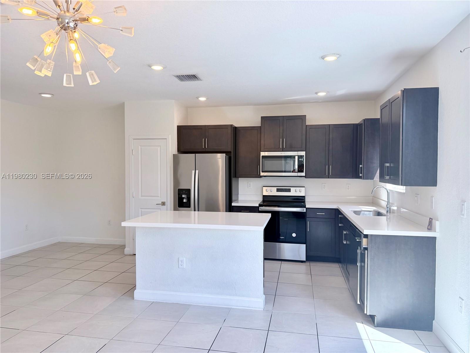 BEAUTIFUL CORNER TOWNHOUSE AT THE TOWNS OF SEASCAPE BY D.R. HORTON. 4 BEDROOMS, 3 BATHROOMS, 1 BEDROOM ON THE FIRST FLOOR. STAINLESS STEEL APPLIANCES IN THE KITCHEN, WASHER AND DRYER ON THE SECOND FLOOR, WITH FENCED BACK PATIO. THE TOWNHOUSE HAS 2 ASSIGNED PARKING SPOTS. COMMUNITY POOL AND CLUB HOUSE.  INCLUDES CABLE AND INTERNET. YOU MUST SEE IT. TILE FLOOR THROUGHOUT. SELLER IS VERY MOTIVATED.