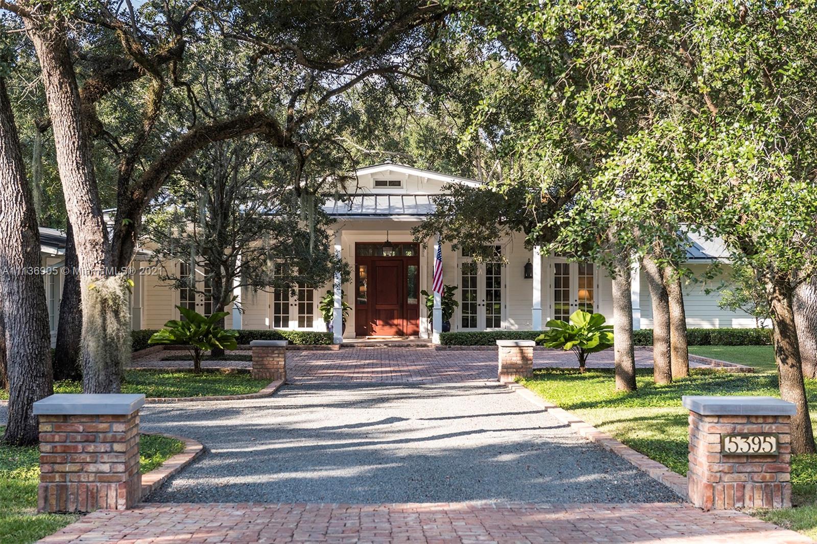 Quintessential Americana-vibe single story pool home in gated community of Snapper Creek Lakes. 5 Bedrooms, 3.5 Bathroom home sits on 1.2 acres of gorgeous and serene manicured landscaping surrounding the salt-water pool. Custom designed kitchen by Frohbose & Beers plus a beautiful picturesque view of the backyard to enjoy while sipping coffee at breakfast every morning. Exquisite details throughout: shiplap walls & coffered ceilings, limestone floors and wide plank walnut floors, impact windows and doors & smart home capabilities.