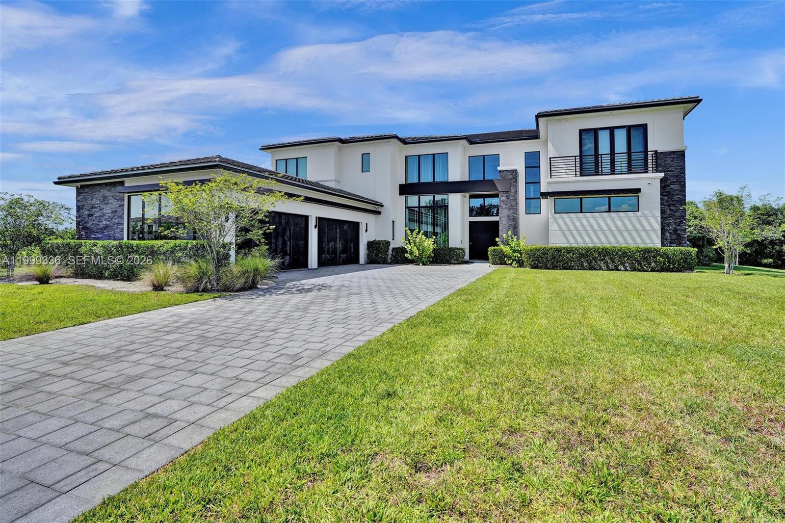 Welcome to a newly construcuted architectural masterpiece by Toll Brothers, located in the prestigious Rolling Oaks community of Southwest Ranches. Set on two(2) expansive acres, this sleek modern estate offers over 8500 sq.ft of thoughtfully designed living space. The home features six(6) bedrooms and seven and a half(7.5) bathrooms, including two grand primary suites-one on each level-each with a spa-inspired bathroom. An open concept floor plan creates a seamless flow between living,dining and entertaining areas, enhanced by soaring ceilings, designer chandeliers, and a dramatic black glass-railed staircase. Upstairs, a private media room with mini-bar provides an ideal retreat, while a wine cellar downstairs caters to the discerning collector. A four car garage offers ample storage and convenience. Built in 2021,this exceptional estate blends elegance, functionality and privacy, making it ideal for those who appreciate equestrian living and expansive grounds. With ample space to design a custom pool and backyard oasis, this home presents a rare opportunity to own a modern luxury residence.