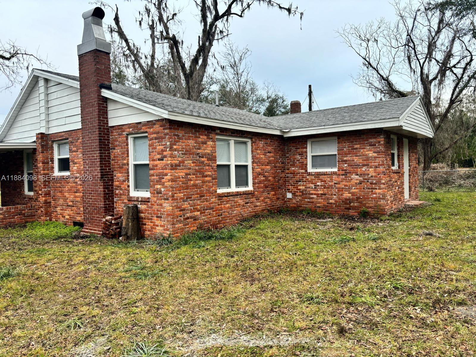 This charming 3-bedroom, 2-bath ranch-style home sits on a spacious 1.53-acre parcel in beautiful North Florida, offering the perfect blend of comfort, privacy, and room to breathe. Designed for easy single-story living, the home features a functional layout with generous living spaces, well-proportioned bedrooms, and a welcoming atmosphere throughout. The expansive land provides endless possibilities—whether you envision outdoor entertaining, gardening, recreation, or simply enjoying the peaceful rural setting—while still offering the tranquility and lifestyle North Florida is known for. FHA ; Conventional welcomes. PRe-Approval and POF required for showings. Serious buyers only .a/c 2021; water-heater like new;roof 10-12 years old ; new floor through-out; plumbing and electrical new .