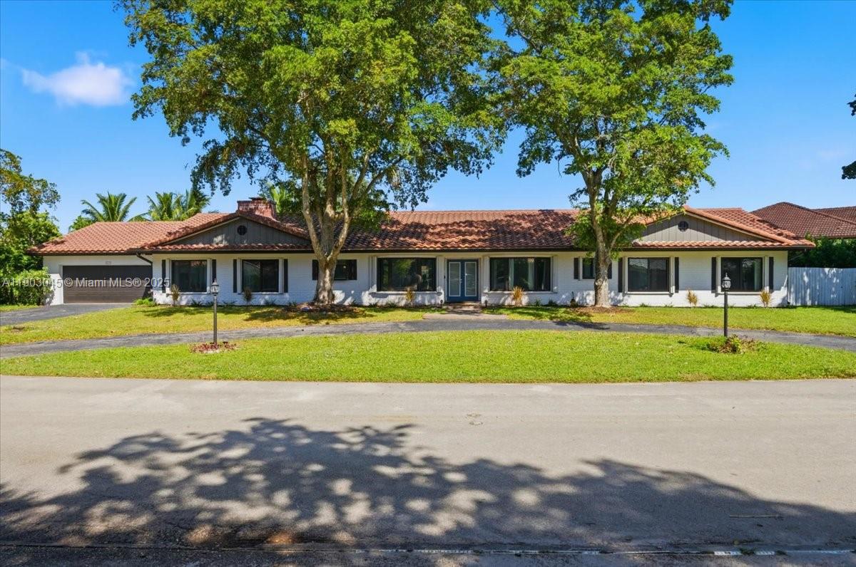 Experience Waterfront Living with this 5-bed, 4-bath Pool Home located in Jacaranda Country Club, one of Plantation’s Most Sought-After Communities. This Residence offers over 3,500 sqft of Living Space on an Oversized 16,117sqft Lot with a Private Pool and Lake Views. The Home features Multiple Family Gathering Areas including a Formal Living Room, Family Room with Fireplace, and Office/Den space. Stacked Floorplan with an Oversized Primary Suite. A Private Mother-in-Law Suite provides ideal guest accommodations. The Kitchen features Custom Cabinets, Granite Countertops, SS Appliances. Additional highlights include a 2-Car Garage, Circular Driveway, Open Patio and Front Porch, and Low Annual HOA fee of just $150. Prime location close to Golf Courses, Top-Rated Schools, Shopping, and Major Highways. Motivated Sellers!