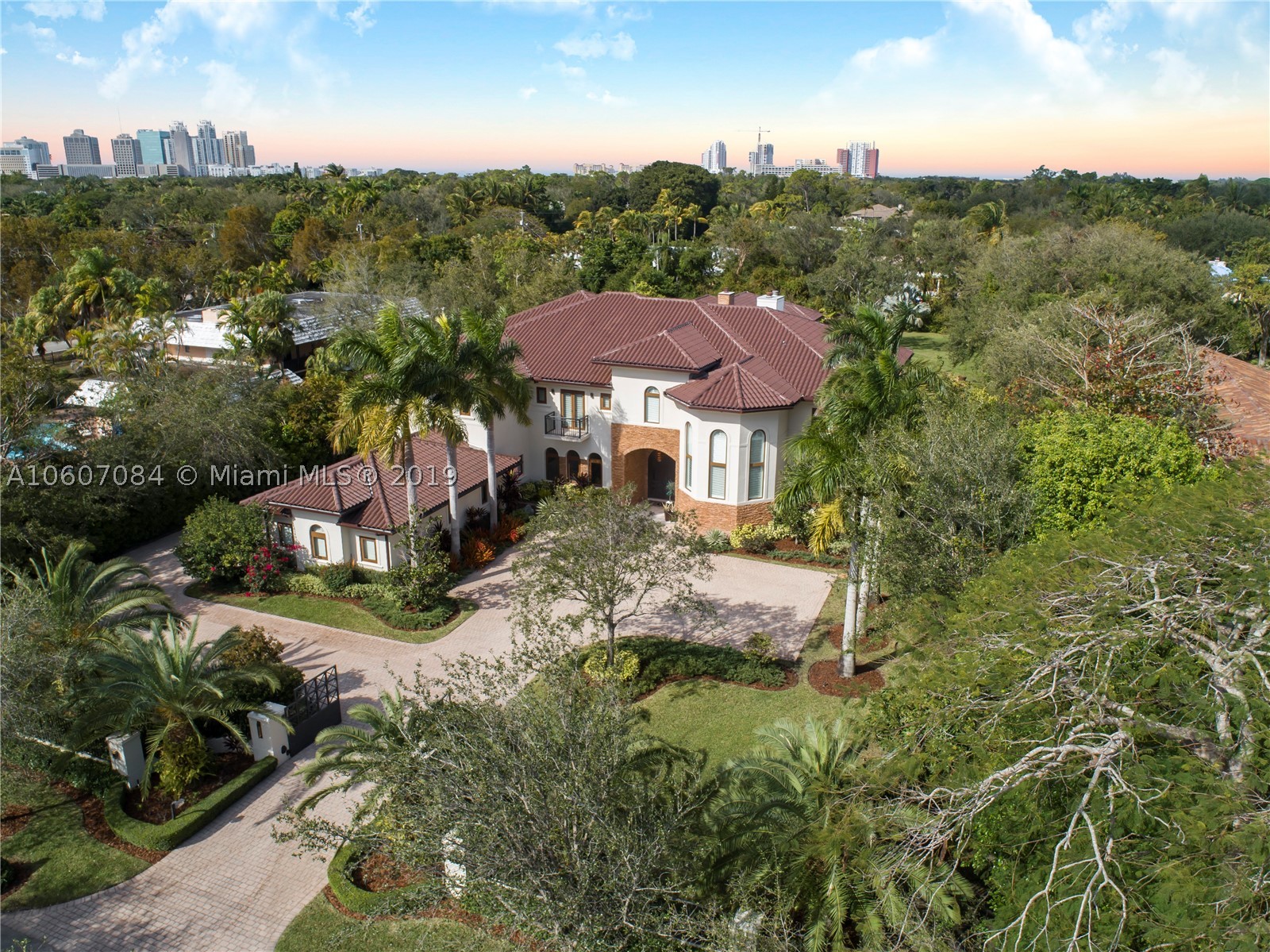 Absolutely Stunning N. Pinecrest Estate appointed with the finest finishes. This revamped contemporary estate is nested on a deep 1.2 acre lot with beautiful manicured landscaping. Enter A Spectacular Floor Plan Boasting over 14,000 Sq. of Amenities, from A Grand & Open Kitchen Featuring Viking Appliances, Elegant Living, Dining & Family Rooms, Climate Wine Cellar, 12 Seat Theater, 4 fire Places, a Grand Master Suite with Sitting Area, Home Office, & a Resort Style Master with Double Water Closets, Massive Closets, Elevator To a detached 2 bed/2 bath Guest or in-law cottage. Other Features: Smart Integration, Resort Style Pool, Large Impact La Finestra Impact Windows and Doors, Large Covered Summer Kitchen, 5 Car Garages, Large Motor Court, & Fully Gated. Premier Pinecrest Schools.