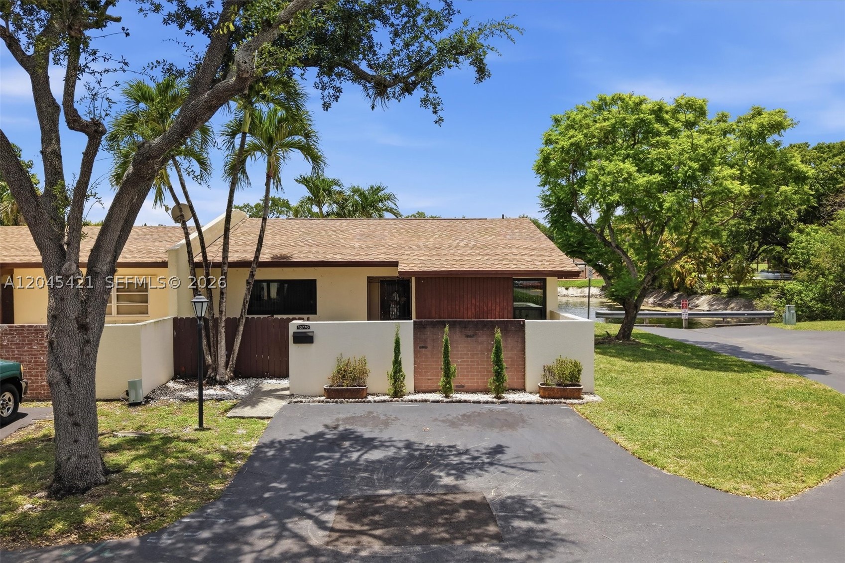 Beautifully maintained 3-bedroom, 2-bath one-story corner unit townhouse in the heart of Kendale Lakes, located along the Miccosukee Golf & Country Club with a great lake view. This inviting home features tile flooring throughout, a bright living area, formal dining space, and a functional kitchen with light wood cabinetry, white countertops, stainless steel appliances, and recessed lighting. Major updates include a newer A/C, newer roof, impact windows, and newer washer and dryer. The spacious primary suite offers an en-suite bathroom and generous closet space. Enjoy a recently renovated backyard/patio area with peaceful lake and golf course views, perfect for relaxing, entertaining, or low-maintenance outdoor living. Low HOA of only $90/month and guest parking available. Conveniently located near shopping, dining, parks, schools, and major roadways. A great opportunity for an owner-occupant or investor looking for a well-kept home in an established Kendall community. Agents, READ BROKER REMARKS.