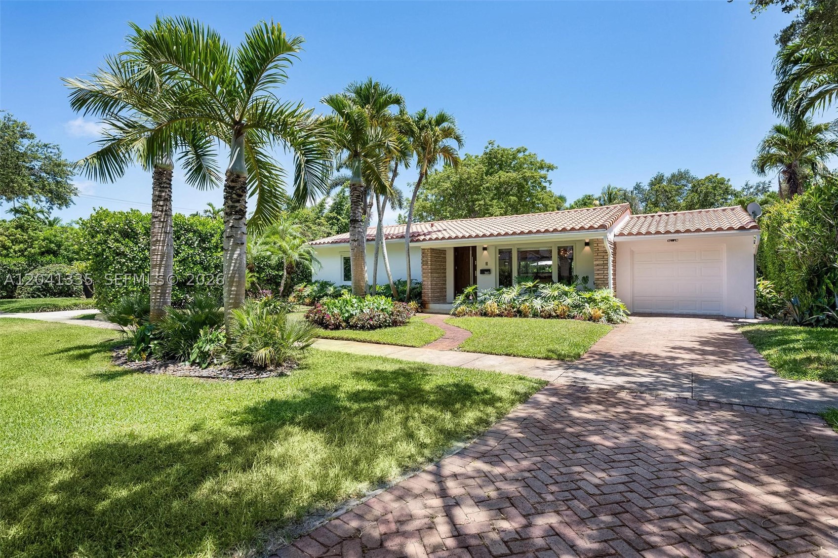 Introducing this exquisite 3-bedroom, 3-bath Miami Shores masterpiece. With over 2,200 square feet of modern elegance, it features a luxurious new addition, a spacious master suite, high ceilings, porcelain floors, impact windows, linear A/C vents, and an open kitchen equipped with Miele appliances, including a Miele built-in coffee maker. Offering a refined and functional space for everyday living and entertaining. Enjoy a saltwater pool on an oversized 10,000-square-foot lot, and an upgraded irrigation pump to support the home’s landscaping. Together, these upgrades reflect a beautiful, modern home. Nestled in the heart of Miami Shores, you're steps from downtown charm—the Children's Theater and a vibrant community center. Nearby are top private schools like Cushman and Miami Country Day, plus golf and recreation. This is luxury living at its finest—ready for you to call home.