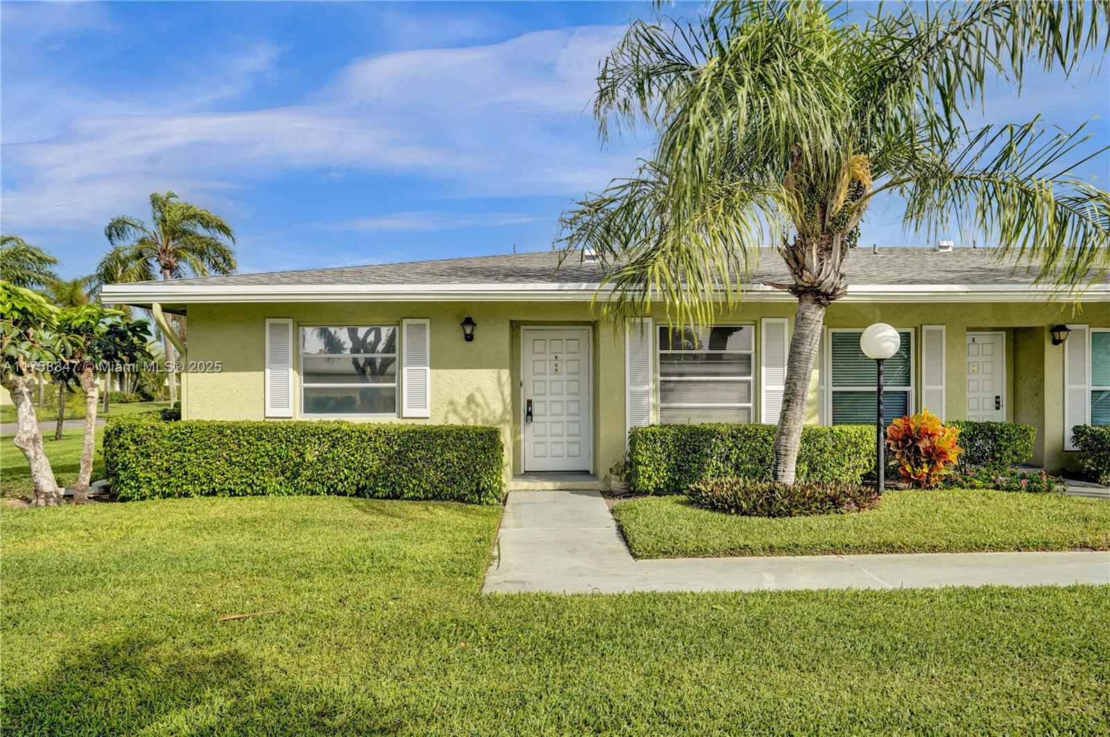 Come live the good life in this corner 2-bedroom, 2-bath villa in The Pines of Delray. 55+ community.  Enjoy flora and fauna and breezes from your open patio with access from both the Primary bedroom and Sunroom.  Plenty of storage space with 2 walk-in closets in Primary bedroom. Large guest bedroom with ensuite bathroom. Washer/dryer inside. Kitchen and breakfast room area are tiled. Rest of villa has brand new carpet. Freshly painted. Clubhouse, pool and shuffleboard. Just a few miles from downtown Delray with popular bars restaurants and night life. Approval by association required. 55+ only. One assigned parking spot in front.