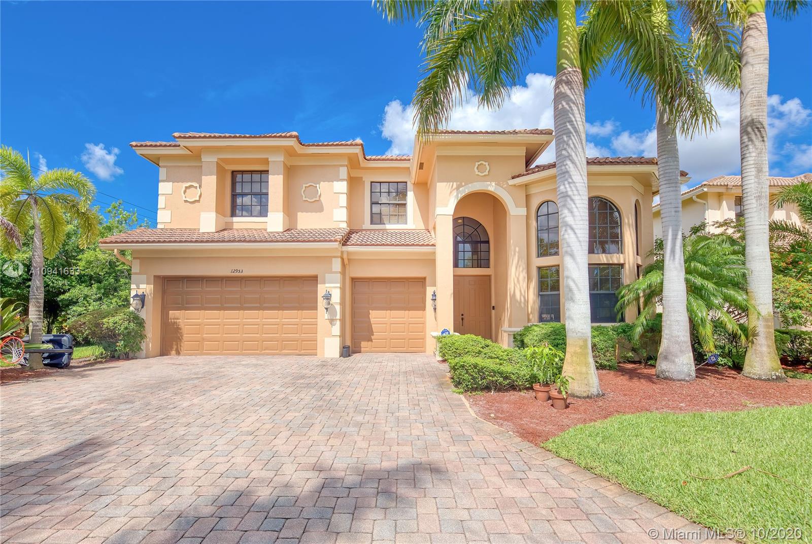This beautiful home, surrounded by one-acre estates, is situated at the end of a cul-de-sac and is very private with no side neighbors.  Huge and spacious entry into the home with 20x20 tiles and a wrought iron grand staircase.  Six bedrooms and five baths with one bedroom on the first floor.  Kitchen has SS appliances, a walk-in pantry and granite counters.  Knock down walls and security system.  Spectacular lush landscape in the backyard with porch and 1/2 bathroom.  A must see!