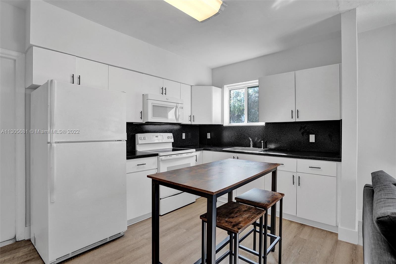 Spacious one bedroom in North Miami area. High impact windows, assigned parking spaces, laundry room and a big backyard. Renovated bathroom and tile floor. It won't last!!Please see Broker Remarks