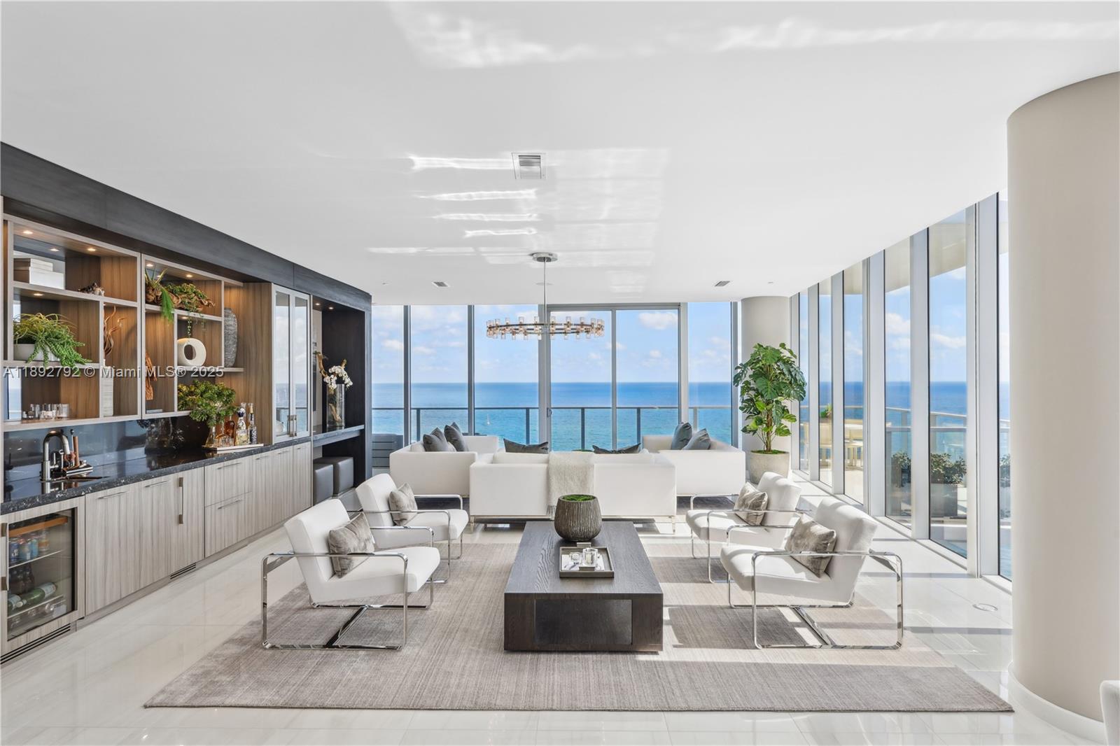First time on the market, this 4 bed/5 bath penthouse spans 4,300 SF inside with over 5,800 SF of exterior space across two stories, standing as the highest and most coveted residence at Auberge. Boasting 180-degree ocean, Intracoastal, and skyline views, floor-to-ceiling glass, custom millwork, full home automation, formal and informal dining, a den, family room, home office, and a private amenity deck with sunroom, plunge pool, landscaping, and deck suite, reverie comes standard. An expansive primary suite features an ocean-facing soaking tub and his & hers walk-in closets, while a custom keypad, private elevator, and foyer ensure utmost privacy. Furniture negotiable. Five-star amenities include Evara Spa, the anticipated Del Mar, concierge, pools, a state-of-the-art fitness center.