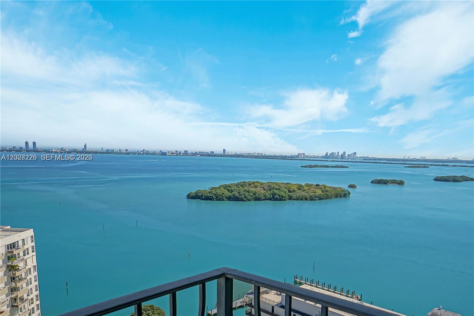 Exceptional high-floor corner residence in the coveted 02 line, offering an extraordinary blend of privacy, elegance, and breathtaking panoramic scenery. This sophisticated 2 Bedroom / 2 Bathroom sky residence features two expansive balconies with sweeping unobstructed views of Biscayne Bay, Miami Beach, and the glittering city skyline extending endlessly to the horizon.
Wake up to spectacular sunrises over the bay and unwind in the evening surrounded by Miami’s dazzling skyline lights. The east-facing terrace showcases magnificent water and skyline vistas, while the north-facing balcony captures endless open views and natural light throughout the residence.
Perfectly positioned with no adjacent neighboring buildings at this floor level, this rare corner unit offers exceptional privacy and a true sense of exclusivity rarely found in condominium living. Floor-to-ceiling natural light enhances the spacious layout, creating an atmosphere of refined waterfront luxury.
The highly sought-after 02 line is celebrated for its premier corner positioning, stunning exposures, and remarkable views from nearly every room.
A rare opportunity to own a private luxury retreat in the sky with iconic Miami views, timeless elegance, and resort-style living at its finest. The Building is currently undergoing its 40-year recertification process. 
NEW IMPACT WINDOWS JUST INSTALLED.
