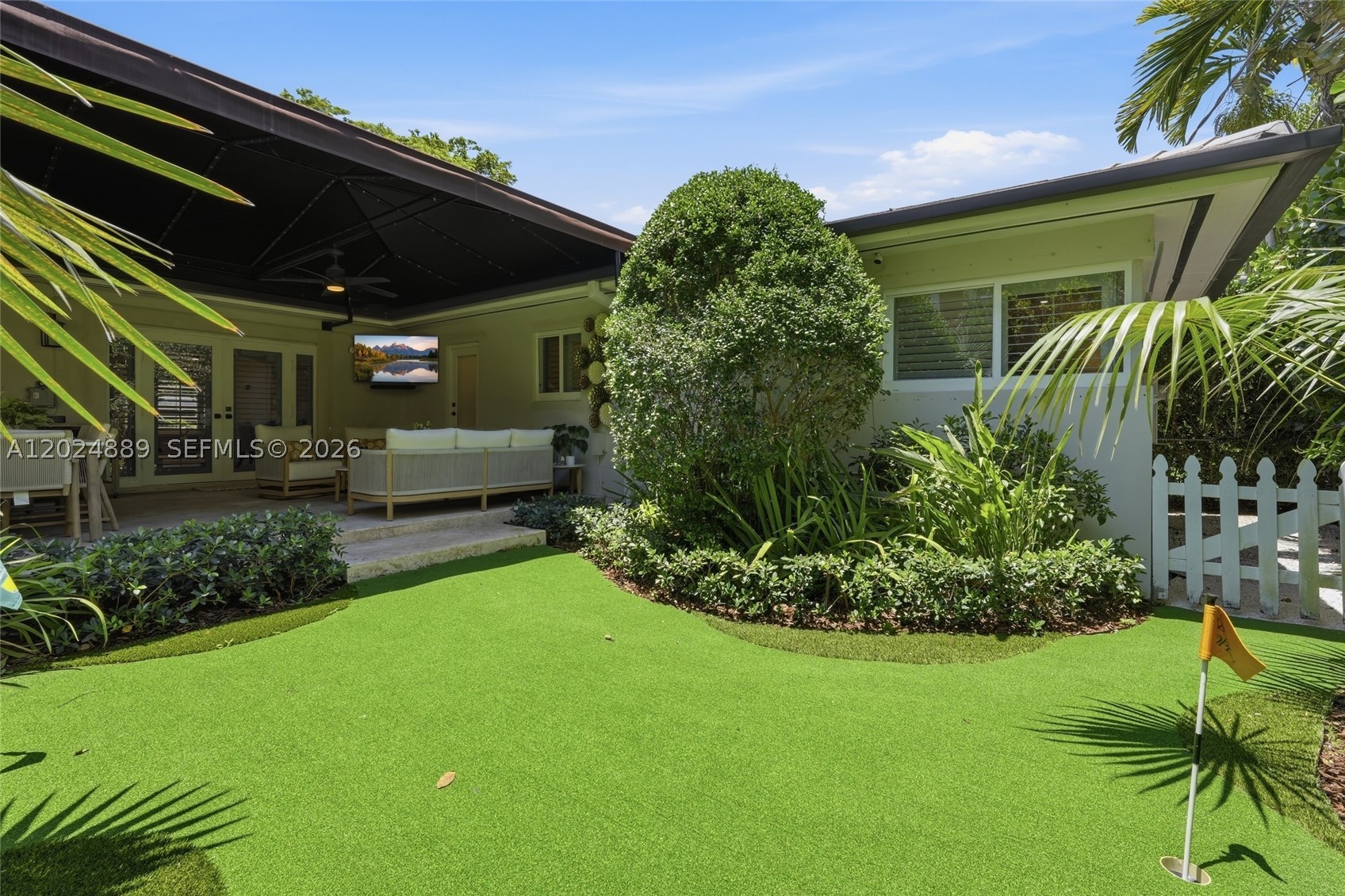 Nestled on a picturesque tree-lined street just steps from the University of Miami, this impeccably maintained and thoughtfully updated 3 bed/2 bath residence offers the perfect blend of comfort, style, and location. Situated outside of the flood zone, the home provides peace of mind with full impact windows and doors, along with updated plumbing and electrical systems.
Designed for both everyday living and effortless entertaining, the lushly landscaped outdoor spaces are truly exceptional, featuring a summer kitchen, putting green, and beautifully curated grounds that create a true backyard retreat. Inside, the fully remodeled primary suite offers high end finishes including a walk-in closet from California closets, Hansgroe fixtures and Toto Neorest in the bathroom, abundant storage throughout, and upgrades at every turn.
Ideally located near Riviera Country Club, Biltmore Hotel, the Shops of South Miami, and other major conveniences, this move-in-ready home presents an outstanding opportunity in one of Coral Gables’ most desirable enclaves. Easy to show, contact Listing Agent today.