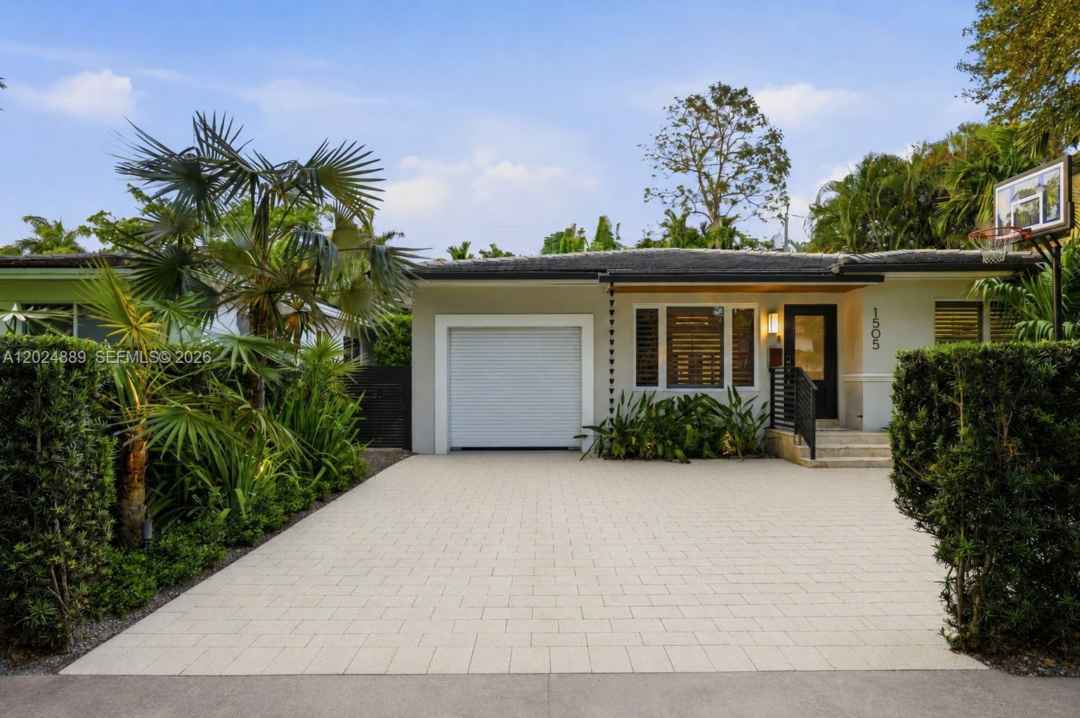Nestled on a picturesque tree-lined street just steps from the University of Miami, this impeccably maintained and thoughtfully updated 3 bed/2 bath residence offers the perfect blend of comfort, style, and location. Situated outside of the flood zone, the home provides peace of mind with full impact windows and doors, along with updated plumbing and electrical systems.
Designed for both everyday living and effortless entertaining, the lushly landscaped outdoor spaces are truly exceptional, featuring a summer kitchen, putting green, and beautifully curated grounds that create a true backyard retreat. Inside, the fully remodeled primary suite offers high end finishes including a walk-in closet from California closets, Hansgroe fixtures and Toto Neorest in the bathroom, abundant storage throughout, and upgrades at every turn.
Ideally located near Riviera Country Club, Biltmore Hotel, the Shops of South Miami, and other major conveniences, this move-in-ready home presents an outstanding opportunity in one of Coral Gables’ most desirable enclaves. Easy to show, contact Listing Agent today.